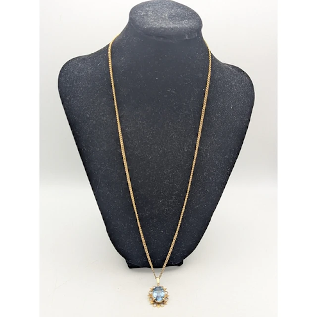 A yellow metal chain link necklace having a spring ring clas...