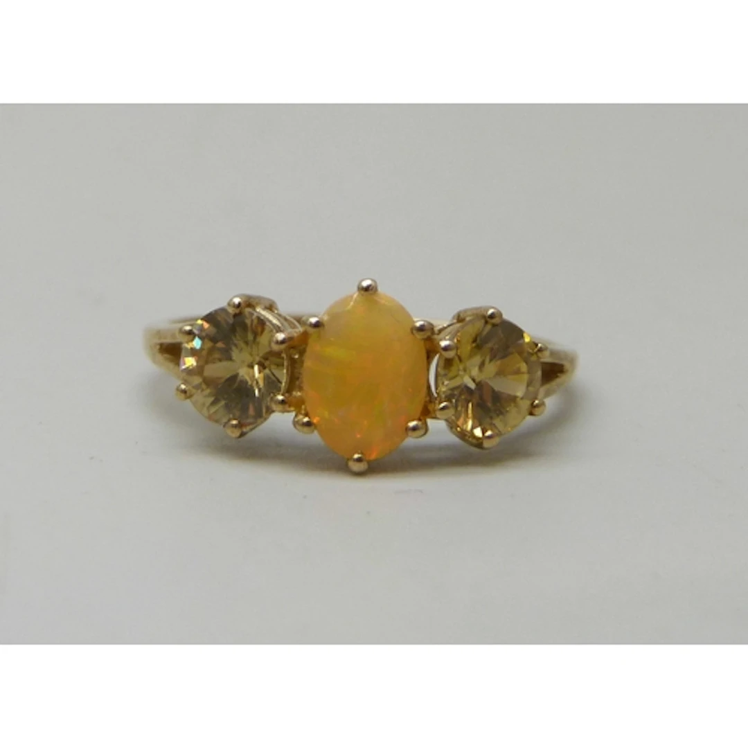 A 9ct gold, fire opal and possibly synthetic yellow sapphire...