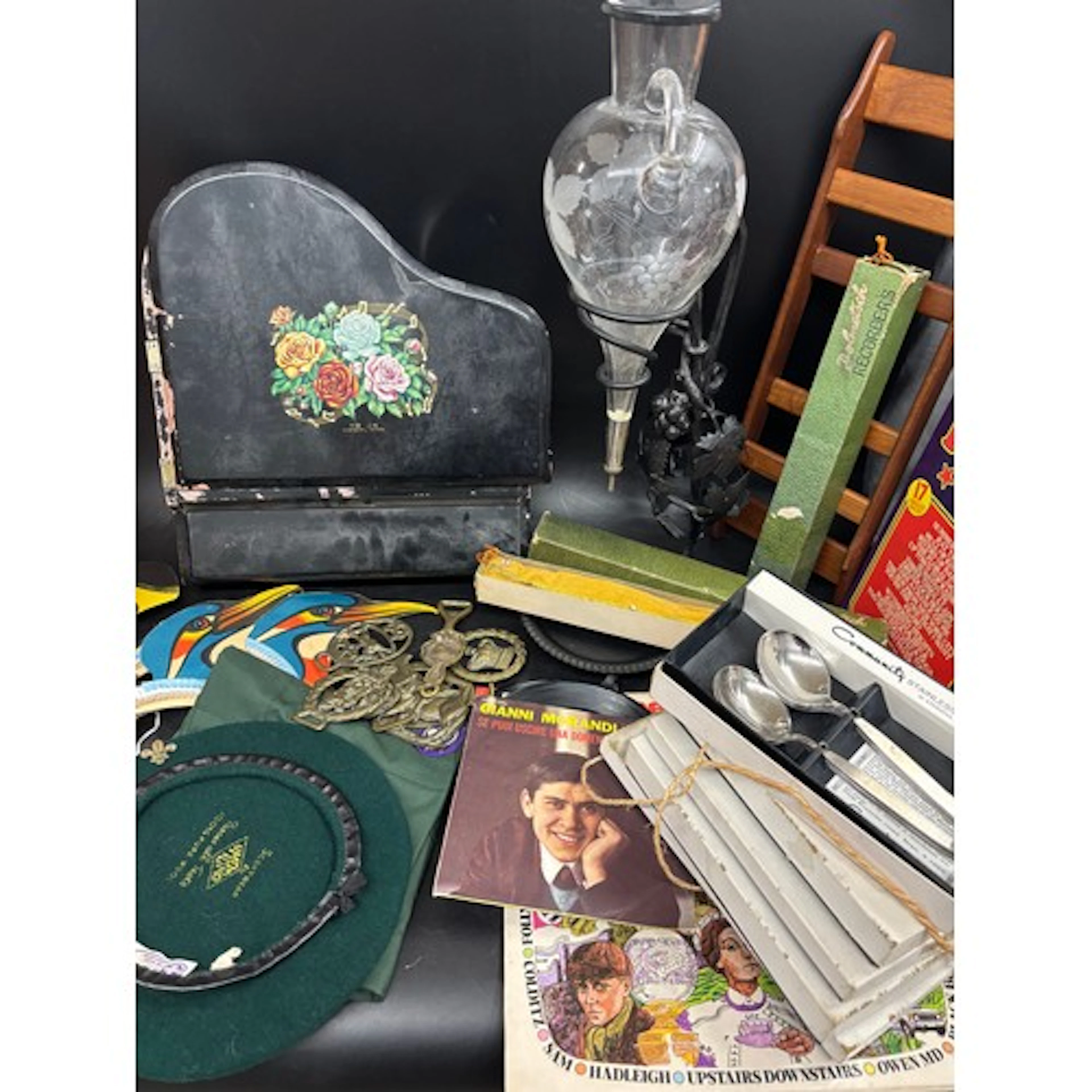 Two boxes of assorted items to include vinyl records and 7" ...