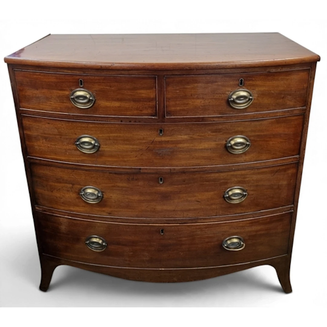 An early 19th Century bow fronted Chest of Drawers with two ...