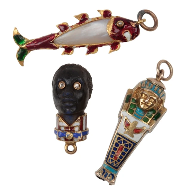 Three enamel charm pendants, early 20th century, comprising:...