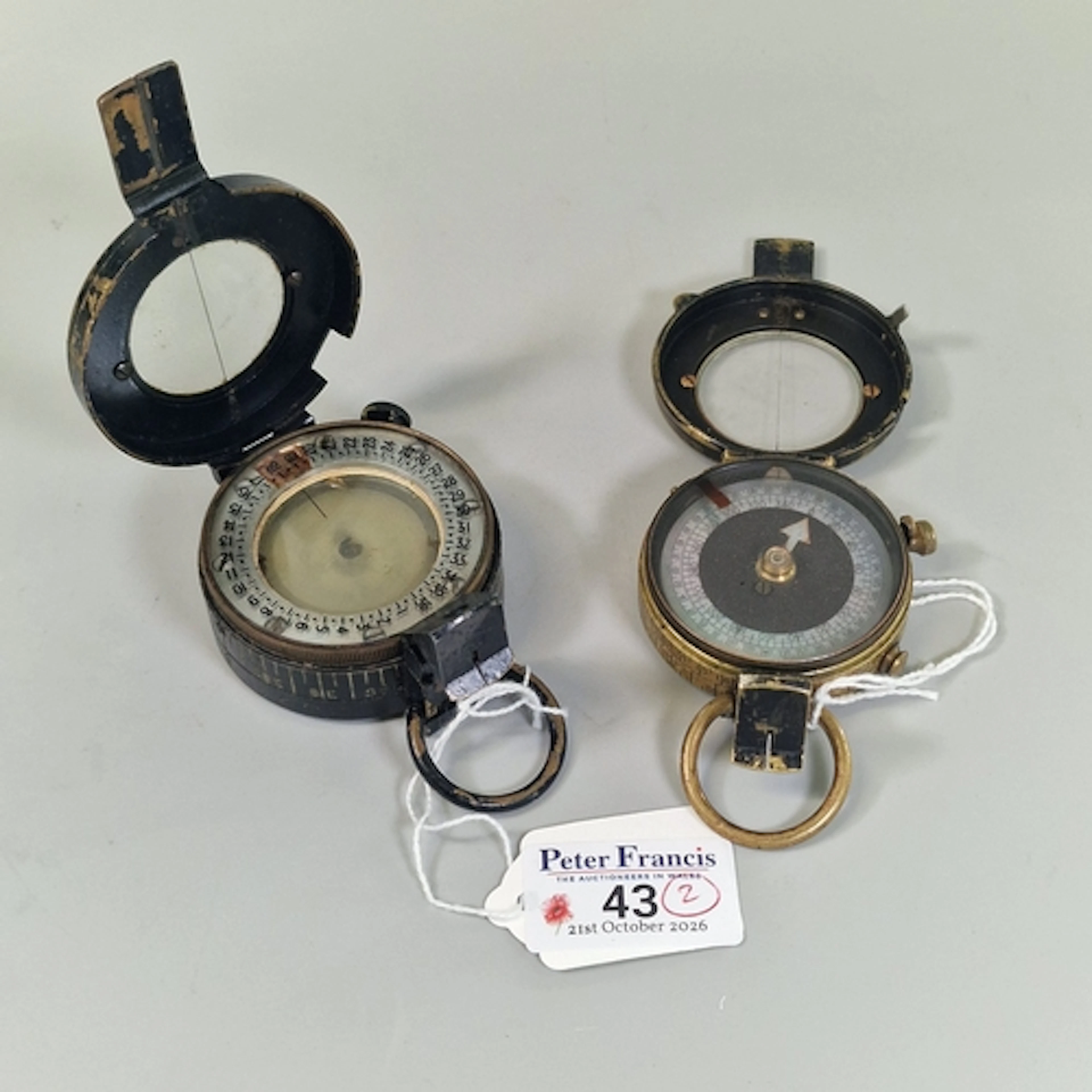 Two British military prismatic marching compasses: a WWI Ver...