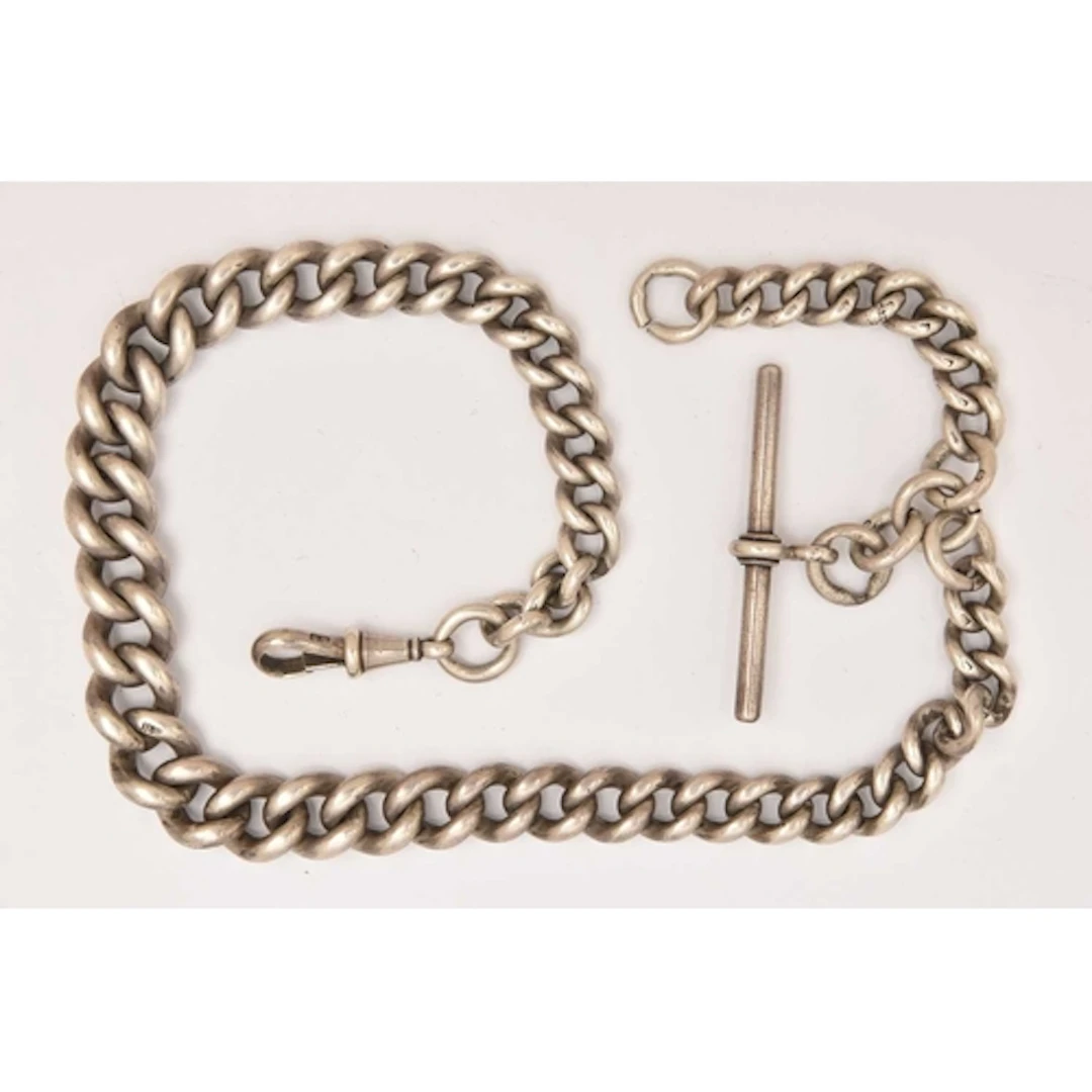 A GRADUATED SILVER ALBERT CHAIN, graduated curb links, each ...