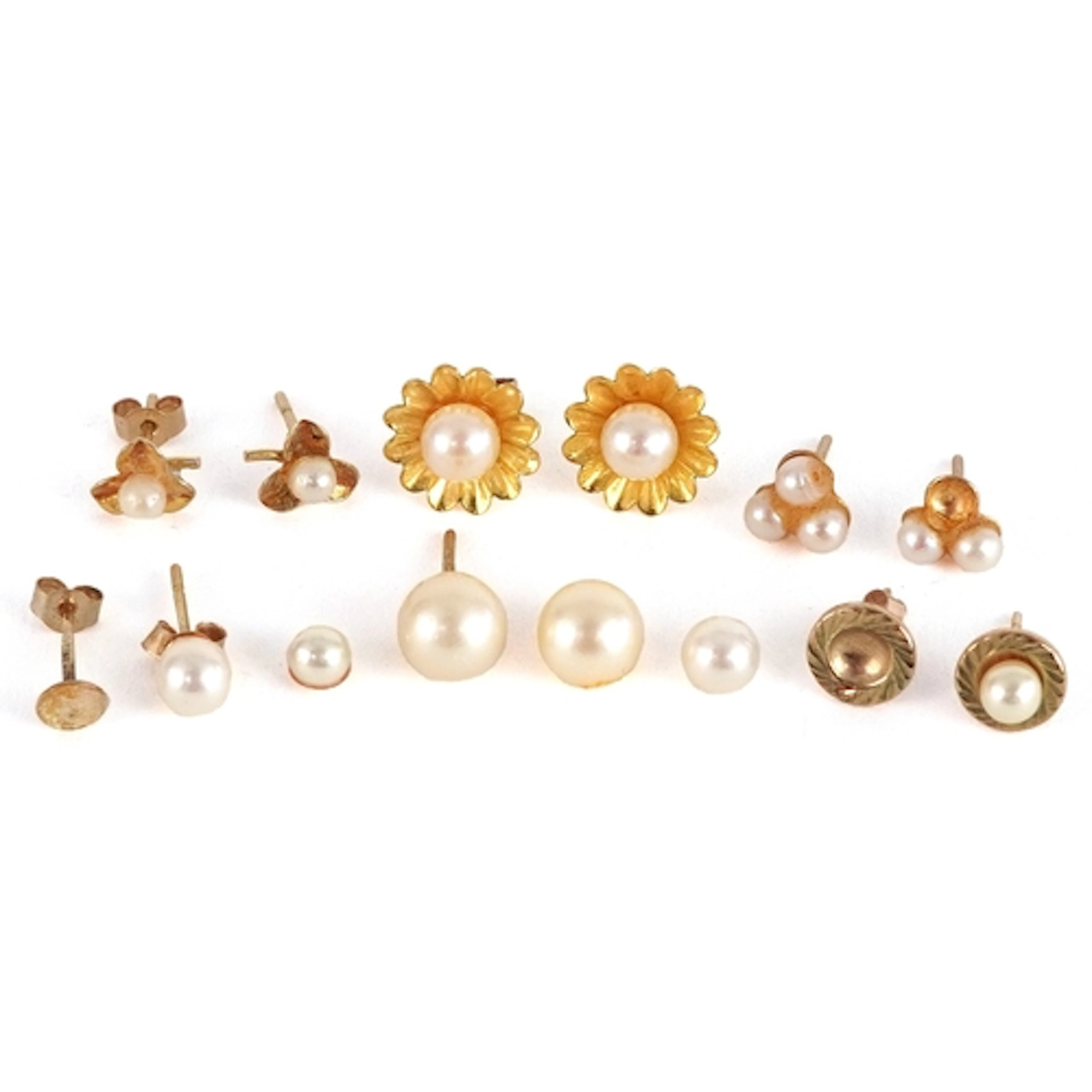 Four pairs of 9ct gold cultured and simulated pearl stud ear...