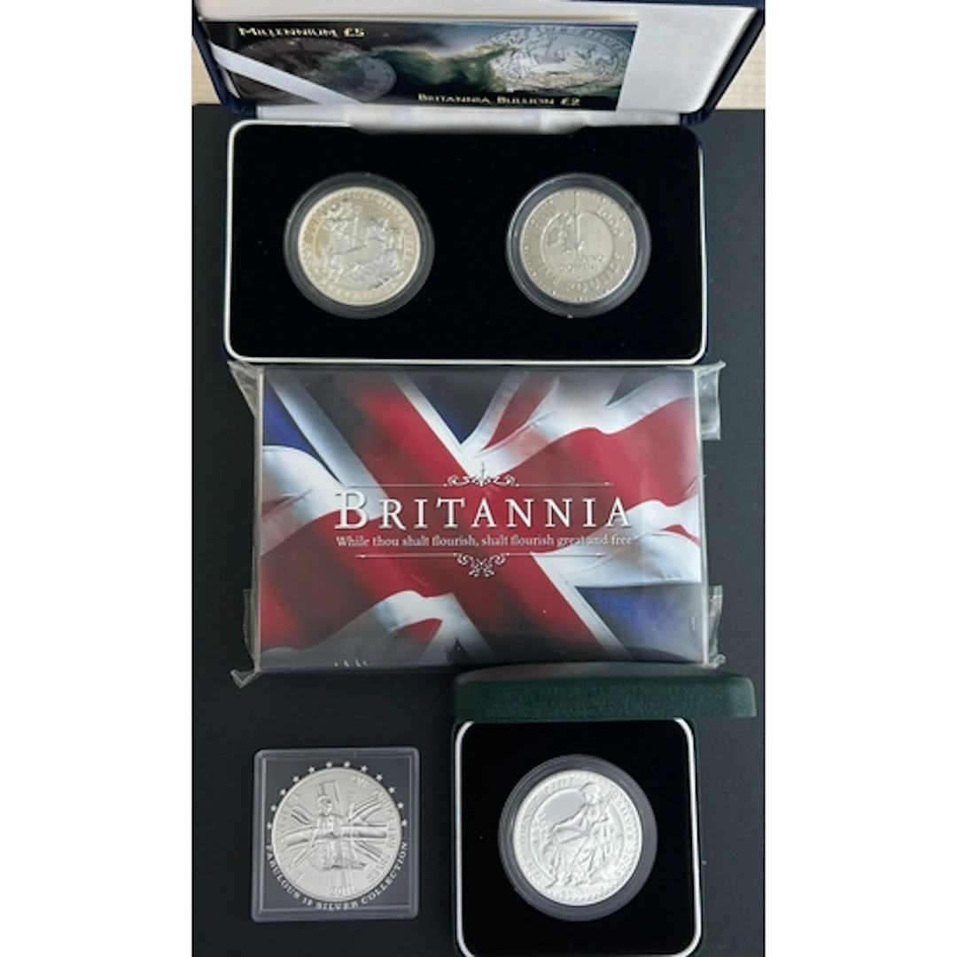 A group of four 1oz UK QEII silver £2 Britannia coins, compr...