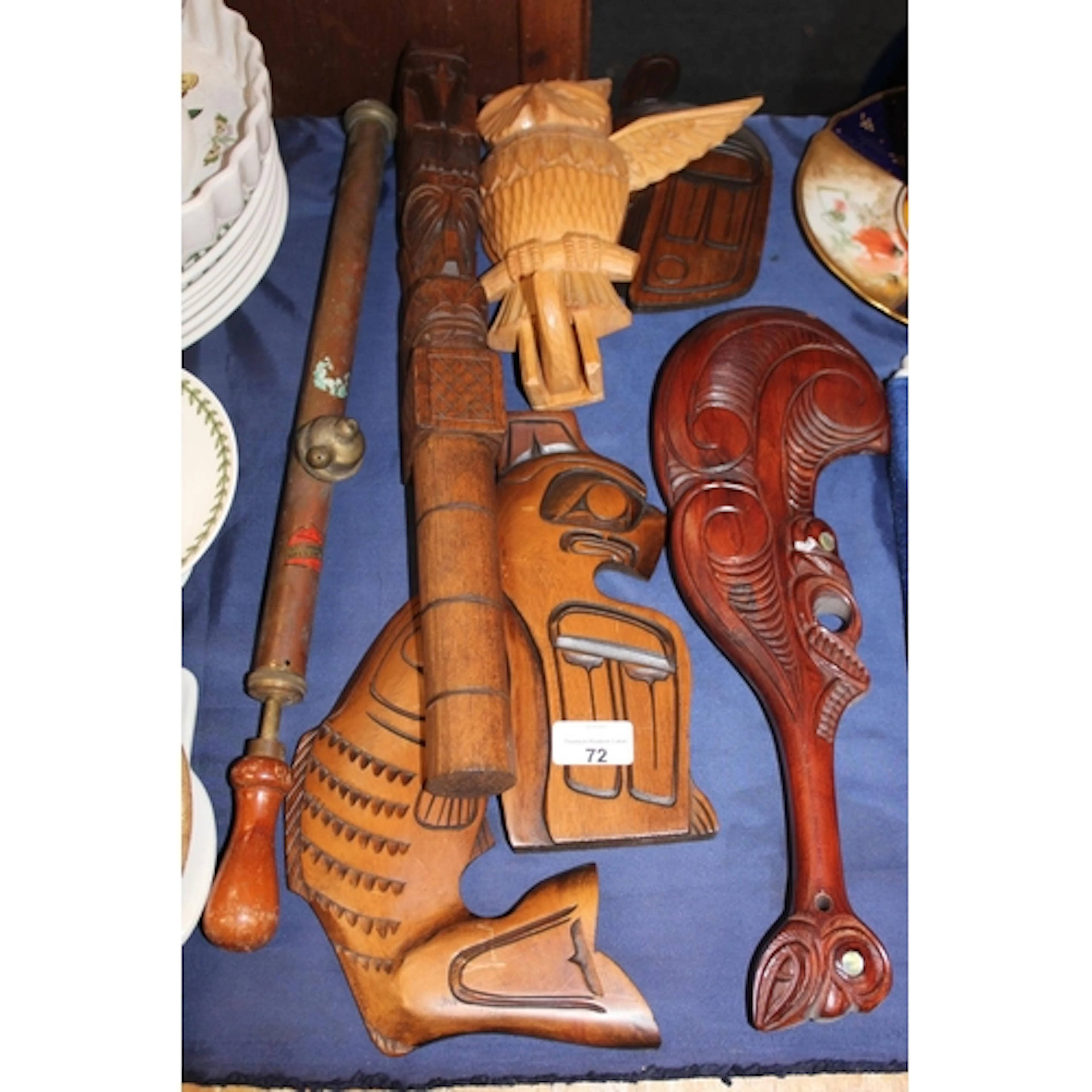 Maori style souvenir war club, Maori style bird and fish car...