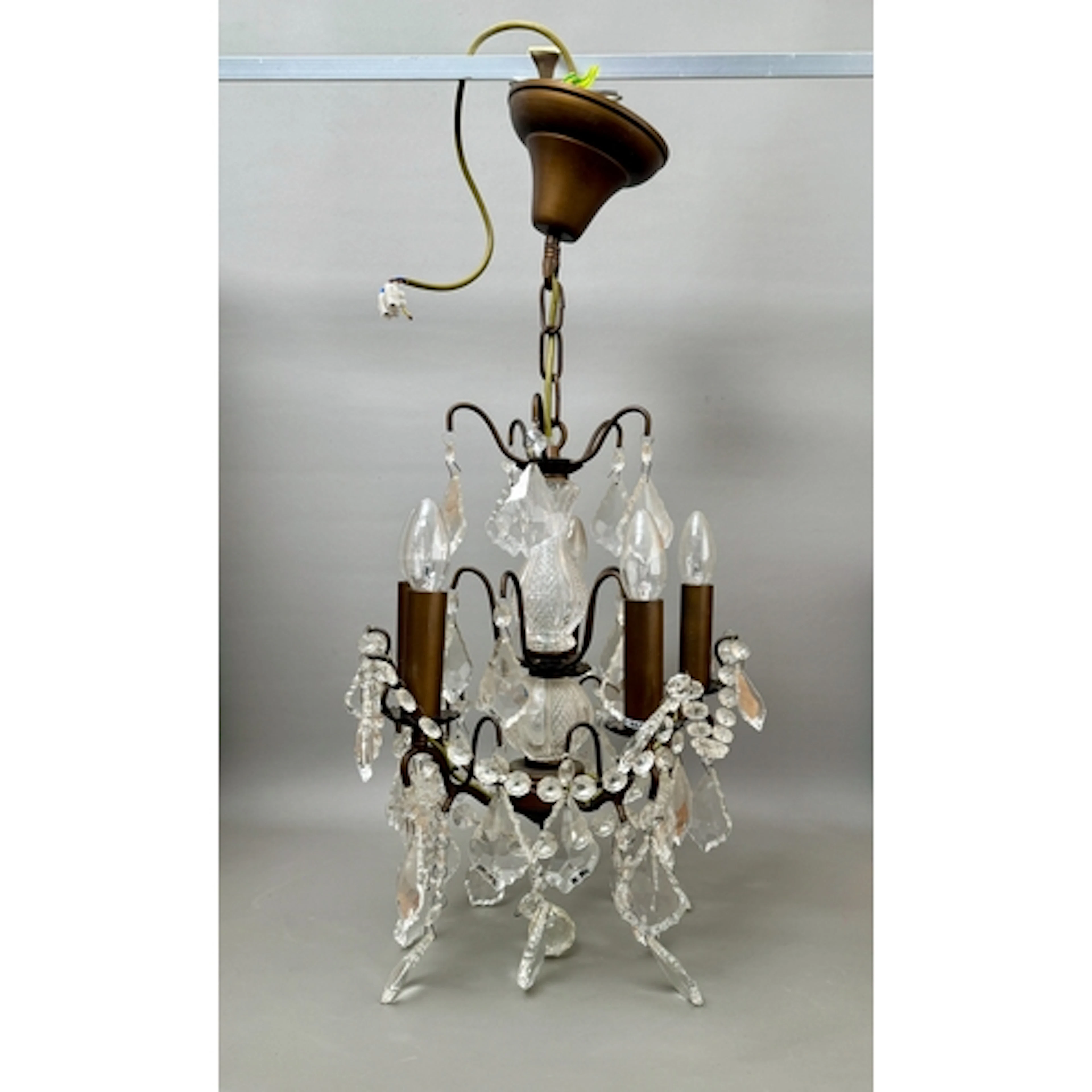 A modern antiqued brass, moulded and cut glass and five-ligh...