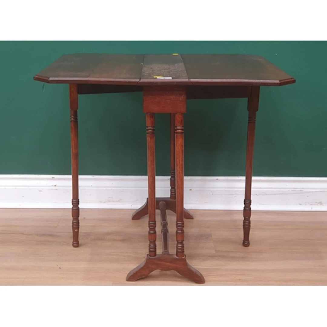 A Victorian mahogany Sutherland Table on turned supports