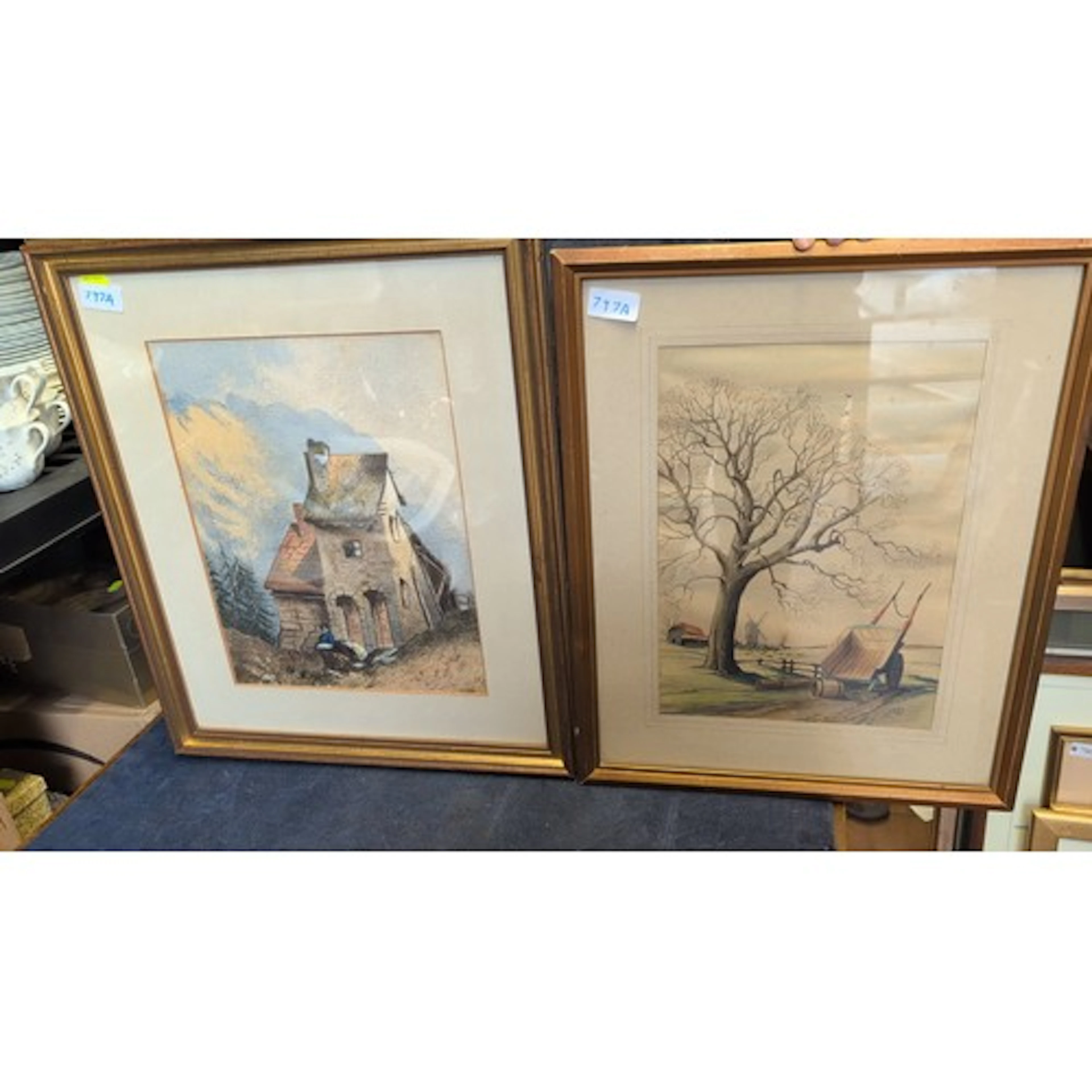 Framed colour print of a rural landscape with leafless tree,...