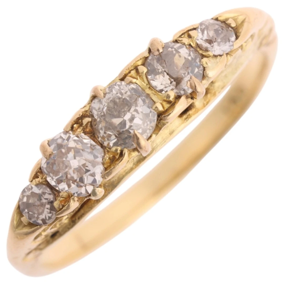 An 18ct gold five stone diamond ring, claw set with graduate...