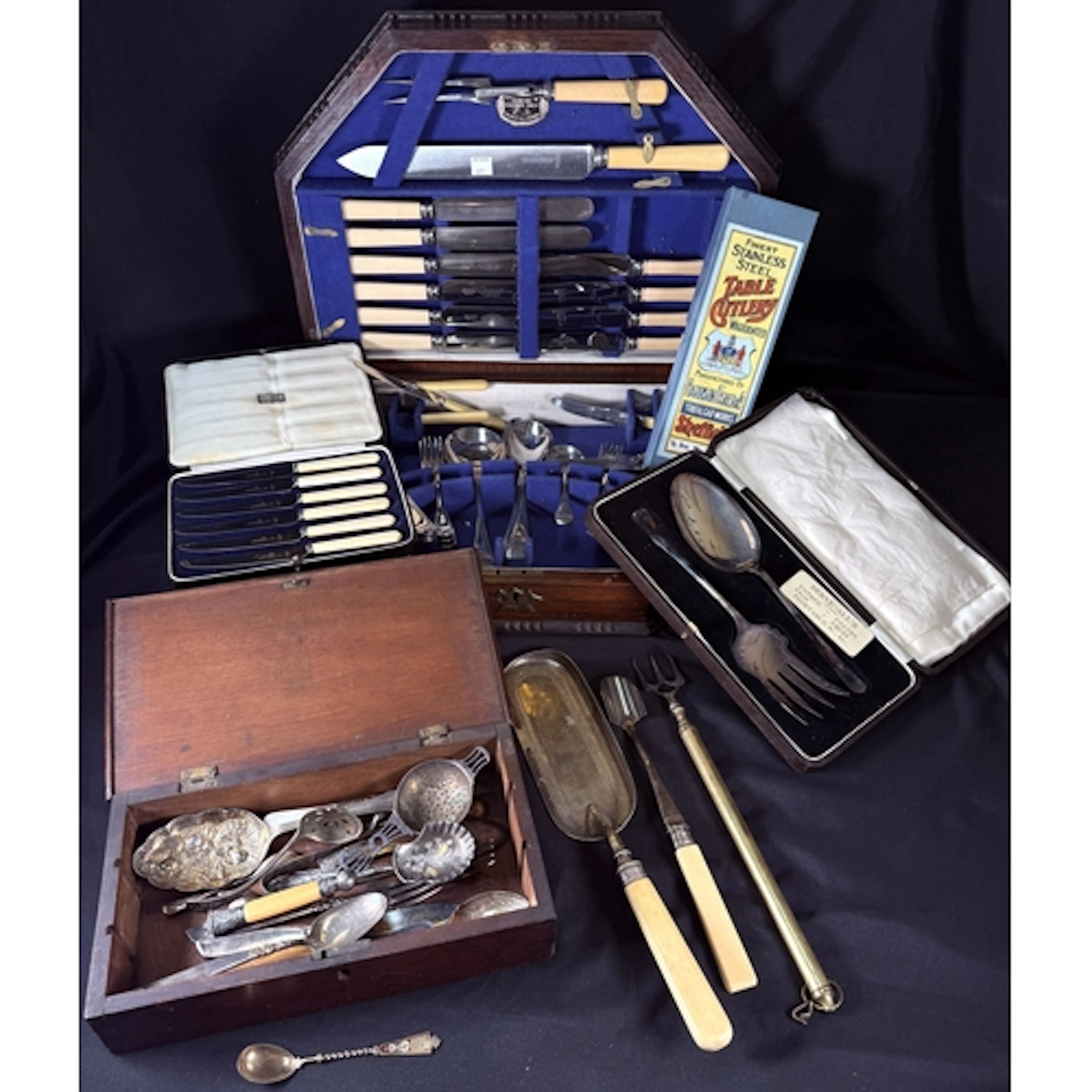 A Fitted oak cutlery canteen box, loose cutlery A cased silv...