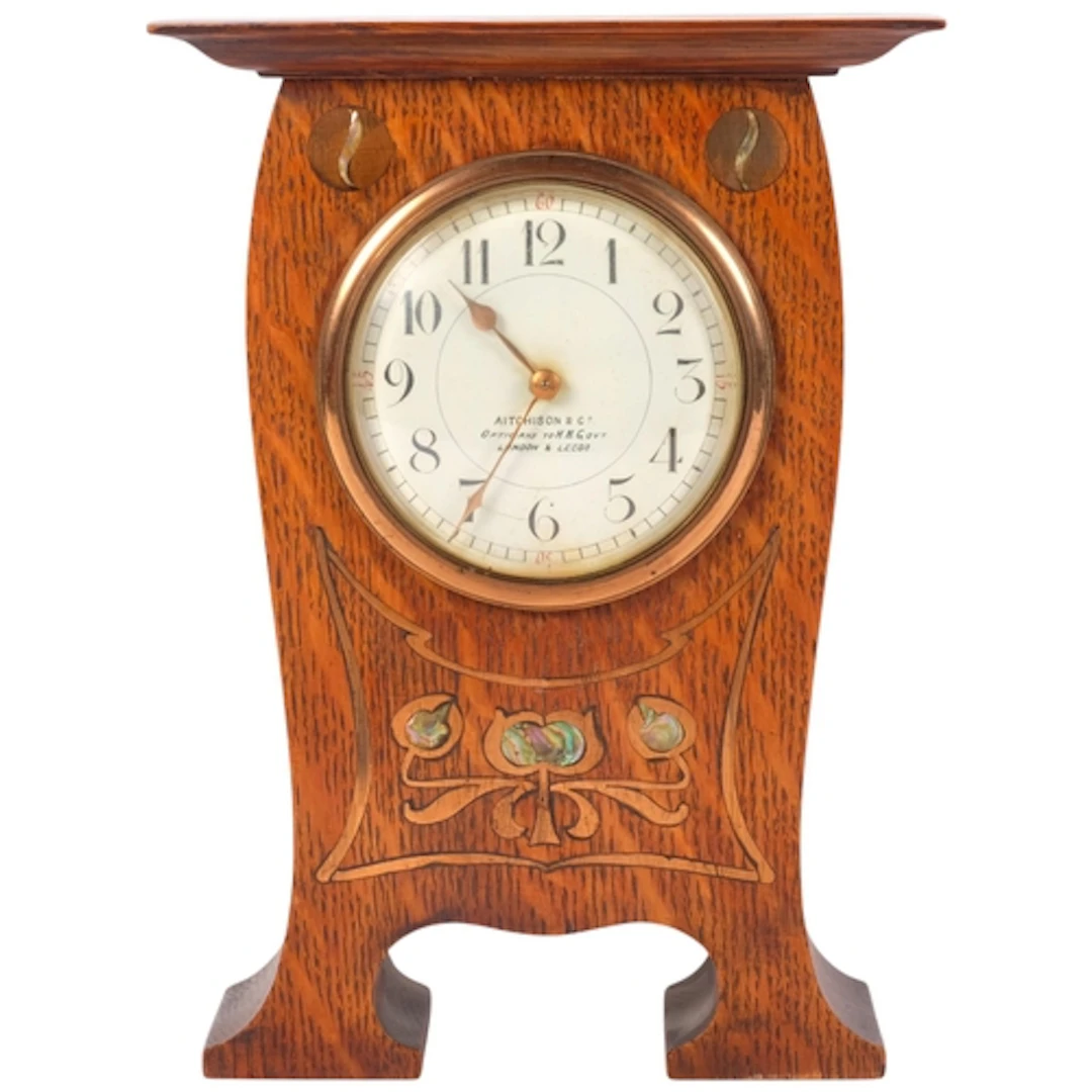 Arts and Crafts oak mantel clock, with copper and mother-of-...