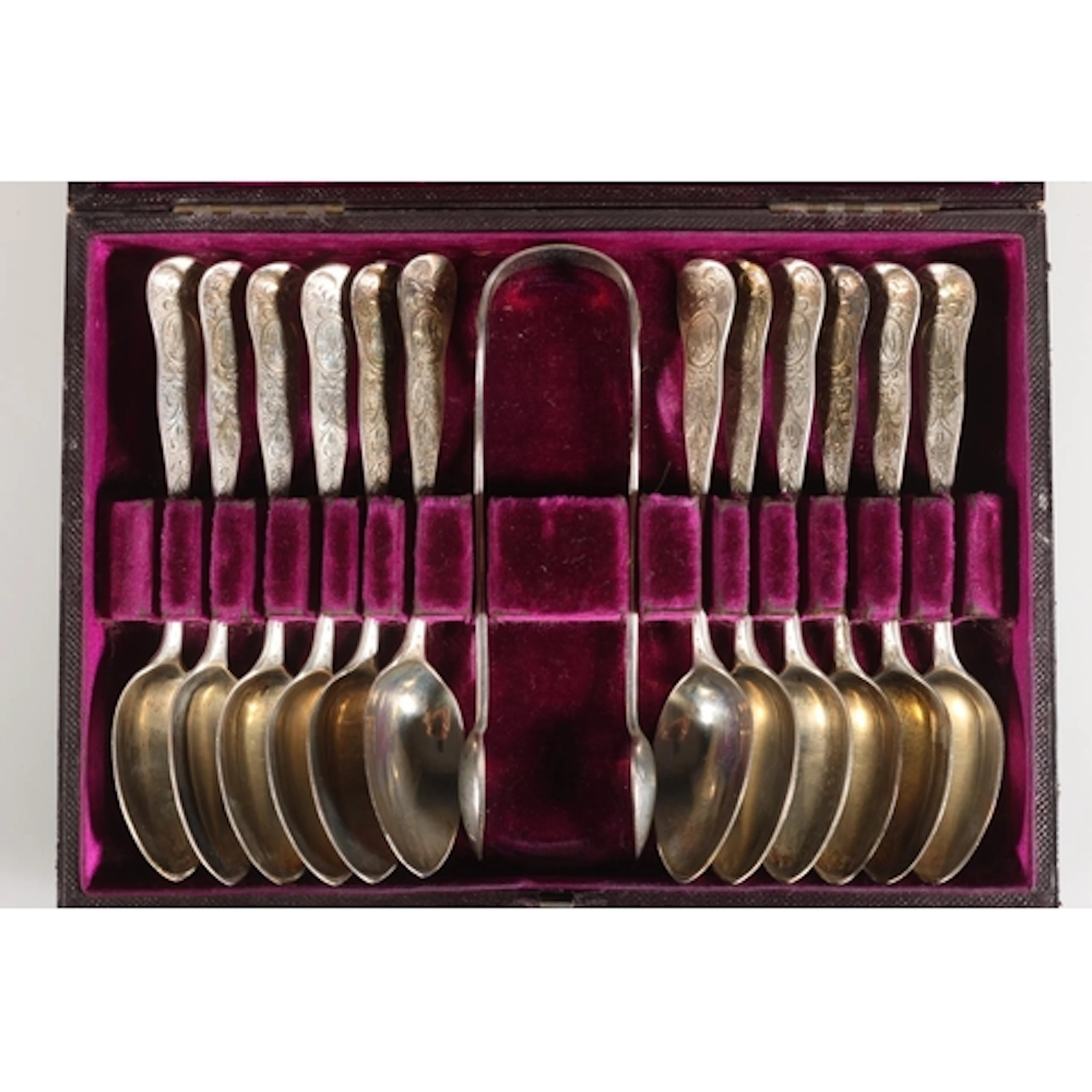 Set of twelve Victorian silver teaspoons and pair of sugar t...