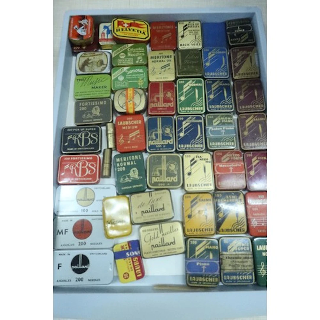 A tray of vintage gramophone needle tins