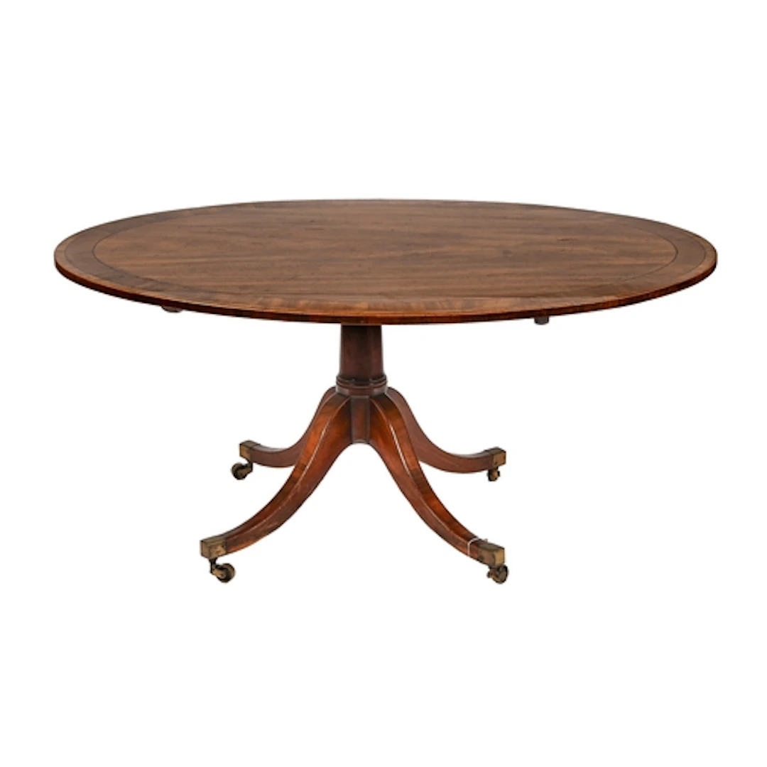 A George III mahogany breakfast table, the oval tip up top c...