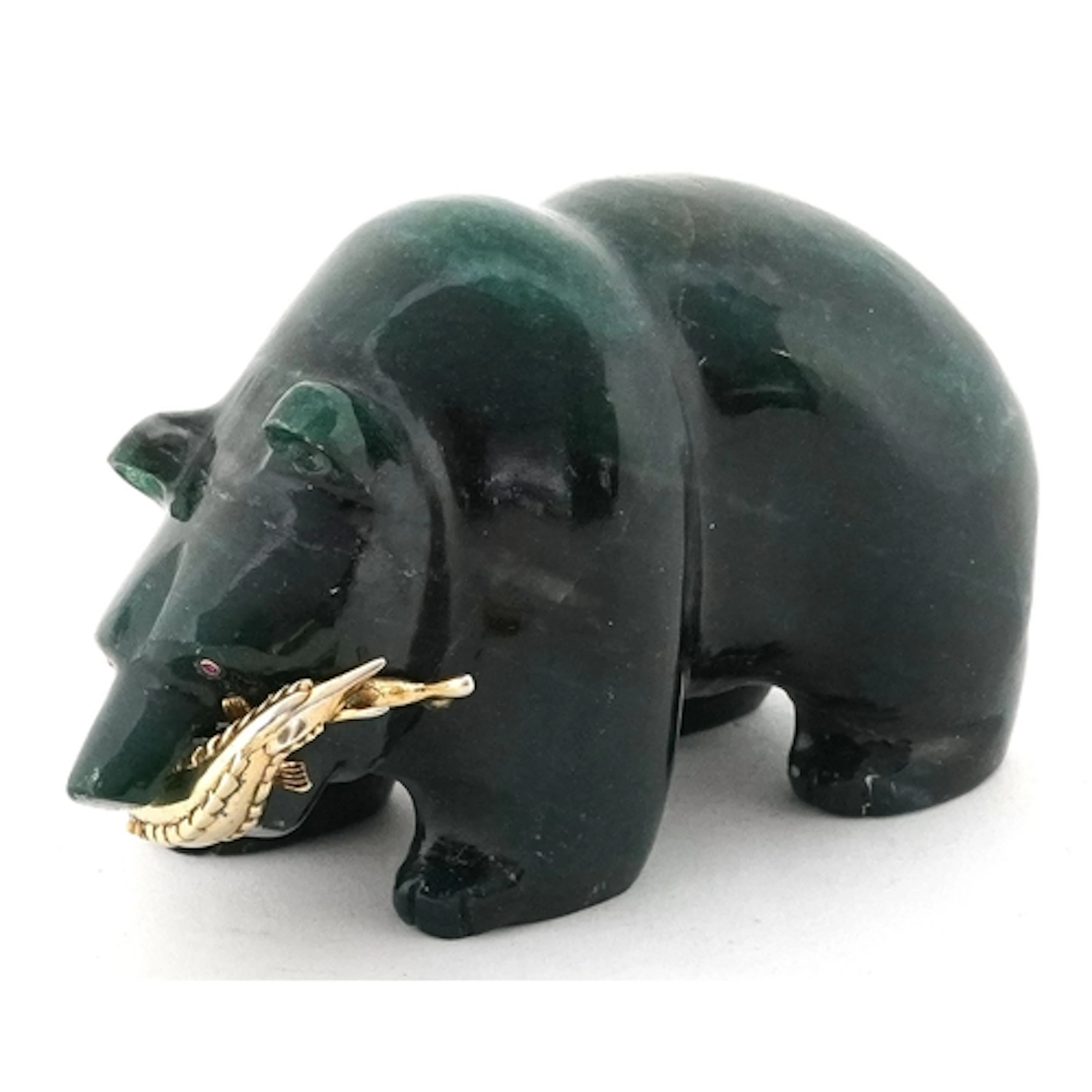 After Fabergé, carved green stone study of a bear holding a ...