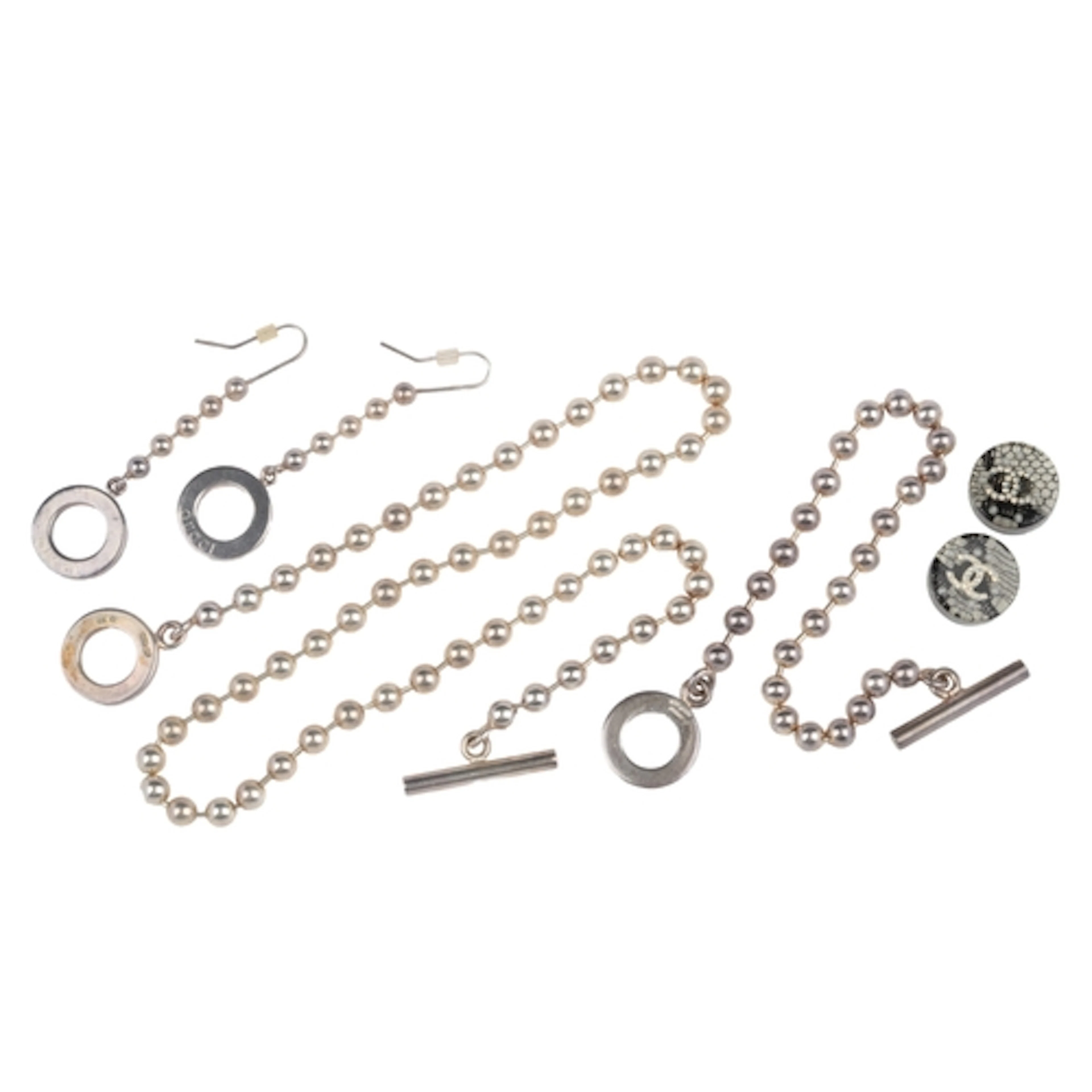 A Gucci silver parure and a pair of Chanel earrings, compris...