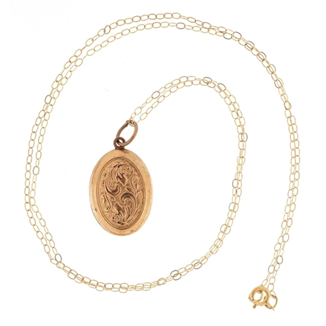 9ct gold floral engraved locket on a 9ct gold necklace, 1.3c...