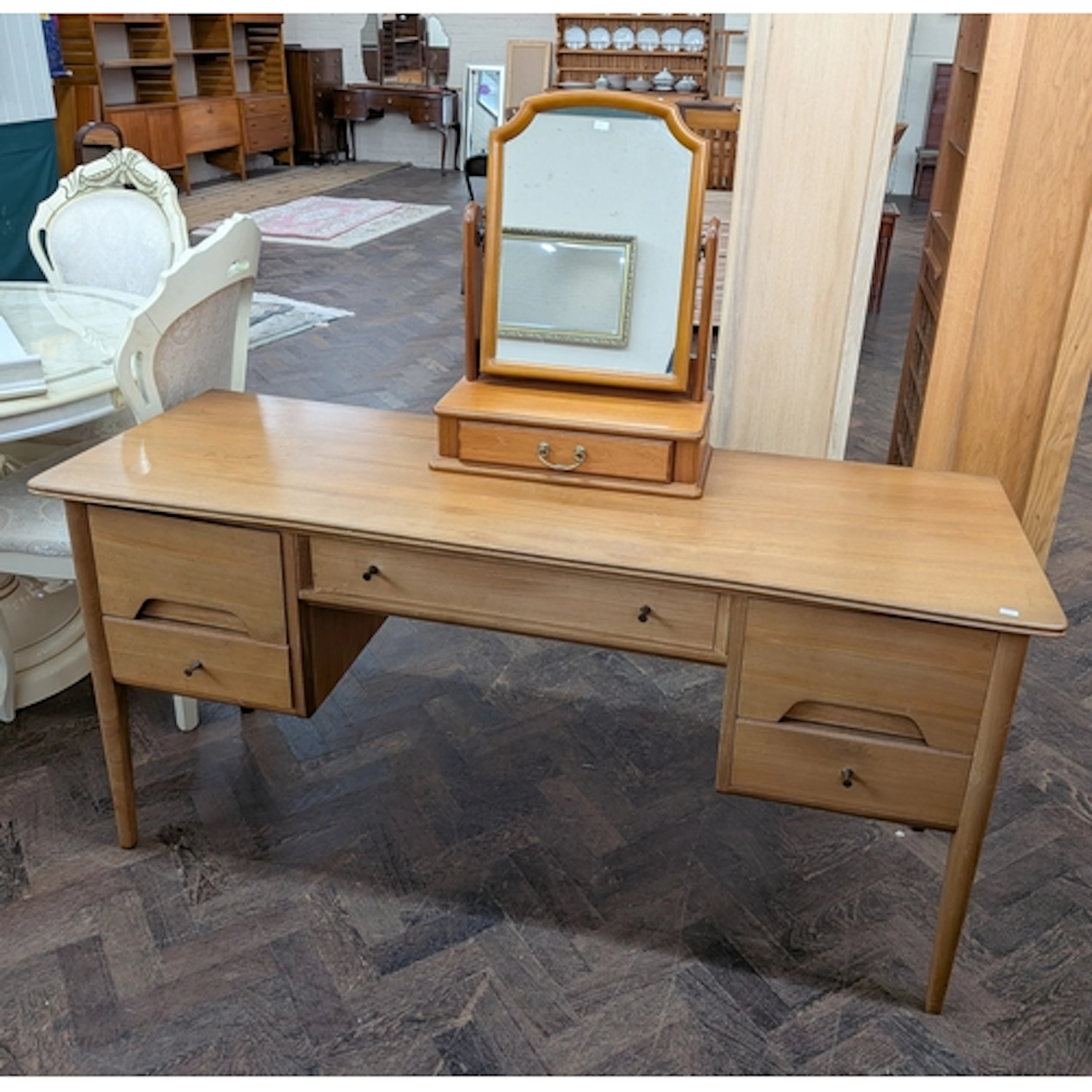 A 1980's teak dressing table fitted five drawers together wi...