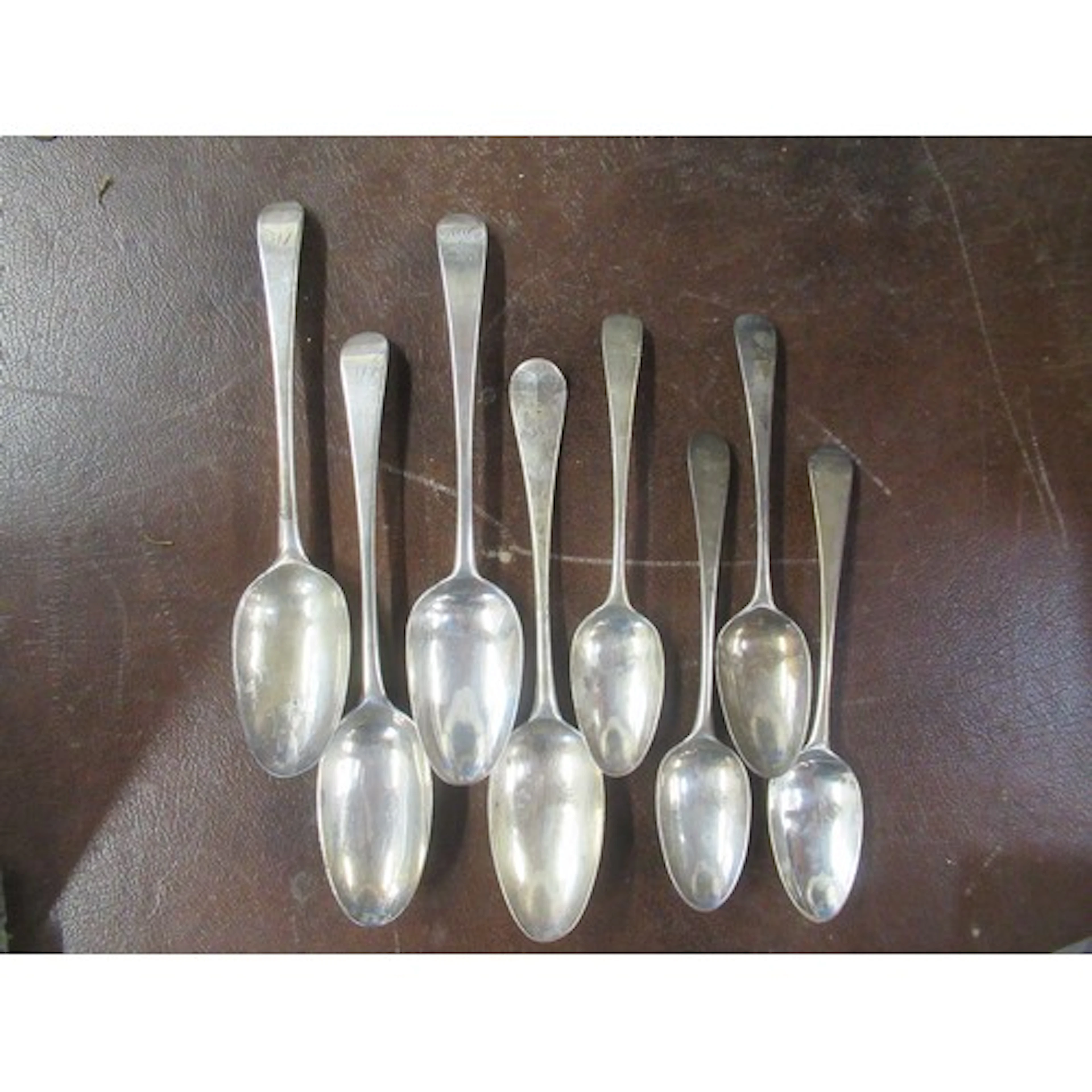 4 mid 18th century silver serving spoons, together with 4 mi...