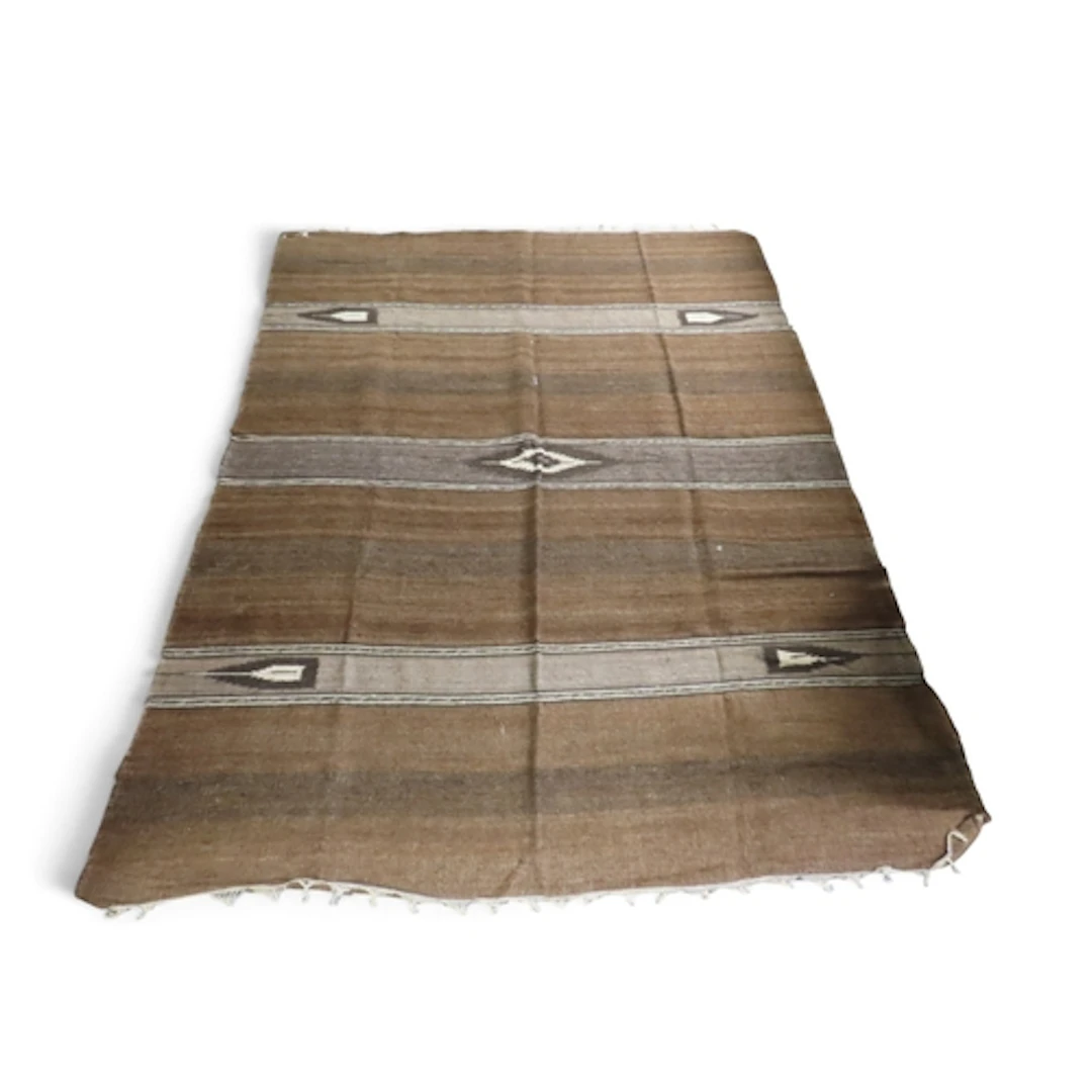 A burnt umber ground Moroccan Berber rug with geometric loze...