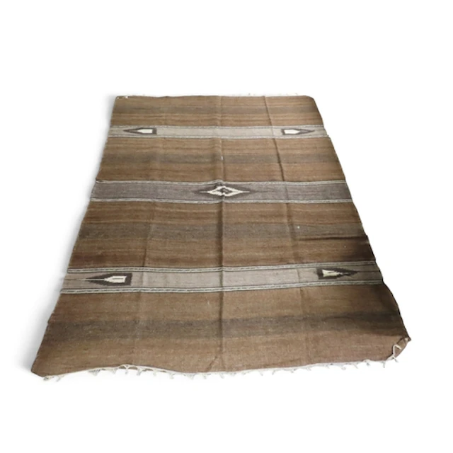 A burnt umber ground Moroccan Berber rug with geometric loze...