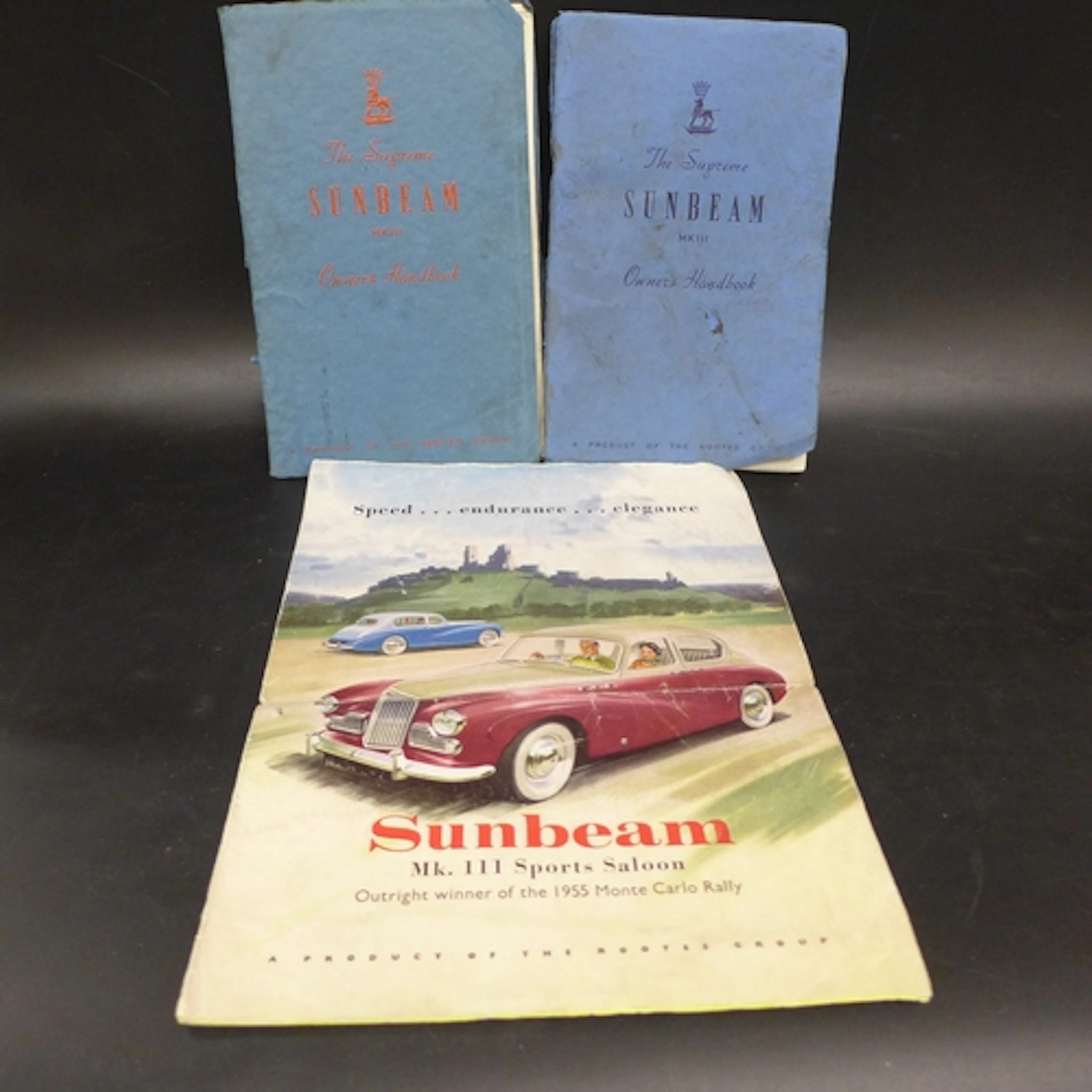 Two Sunbeam MkIII owner's handbooks together with a poster/a...