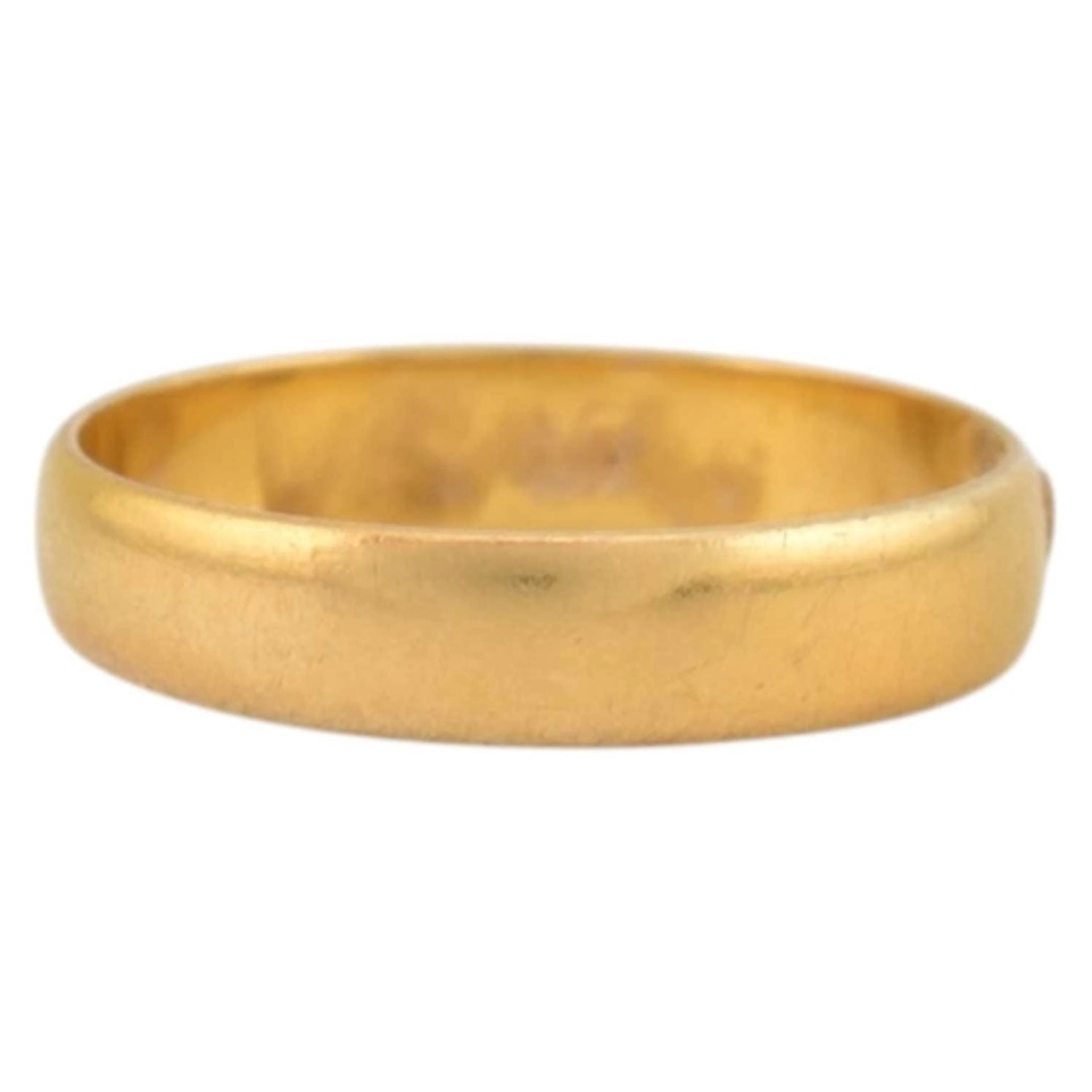 An Edwardian hallmarked 22ct gold wedding band. Hallmarked B...