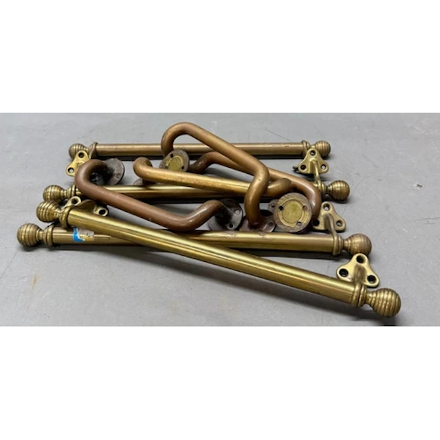 A selection of vintage brass door handles.