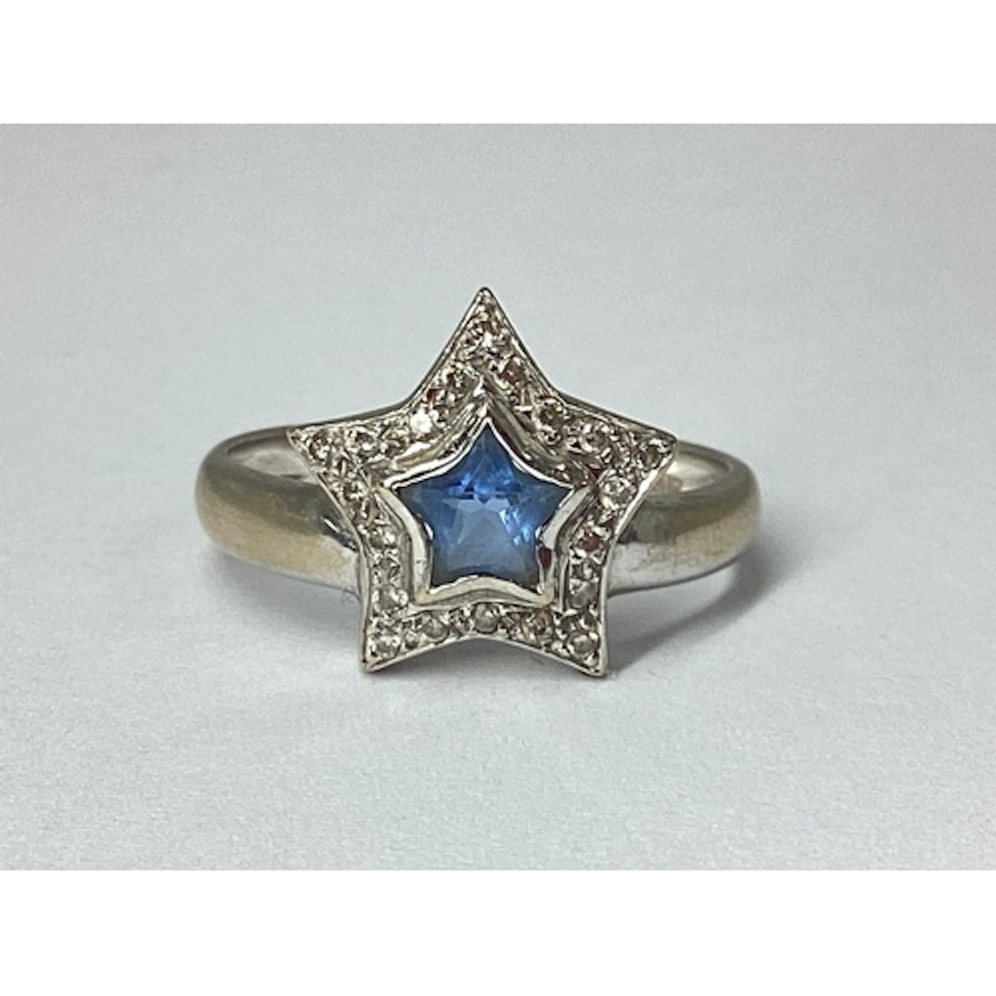 A Modern Sapphire and Diamond Set Dress Ring, of star design...
