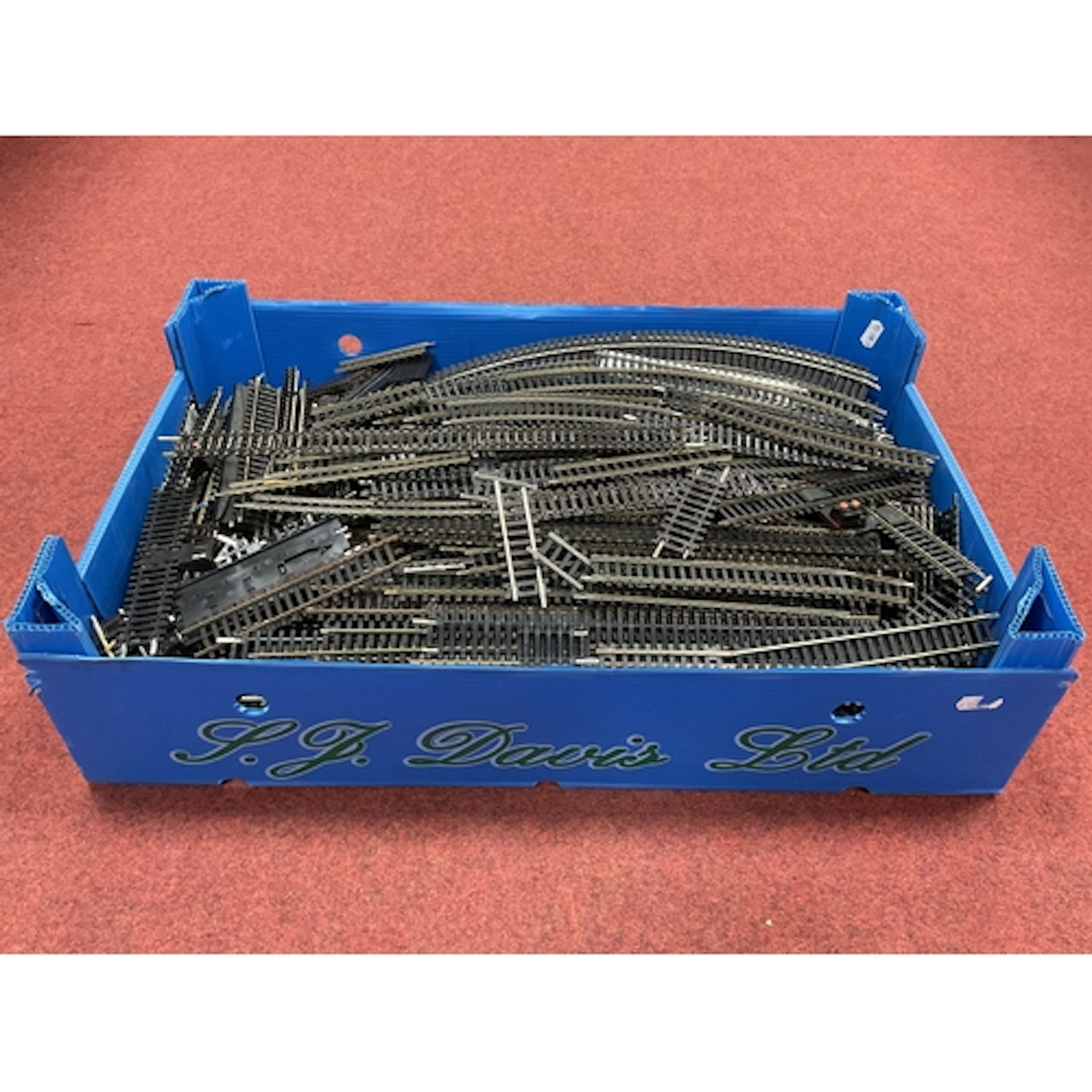 A quantity of 00 gauge nickel-silver sectional track by Peco...