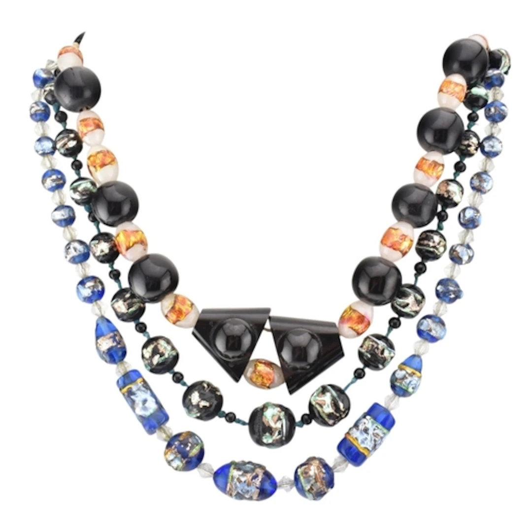 Three foiled glass necklaces. The necklaces to include: a bl...