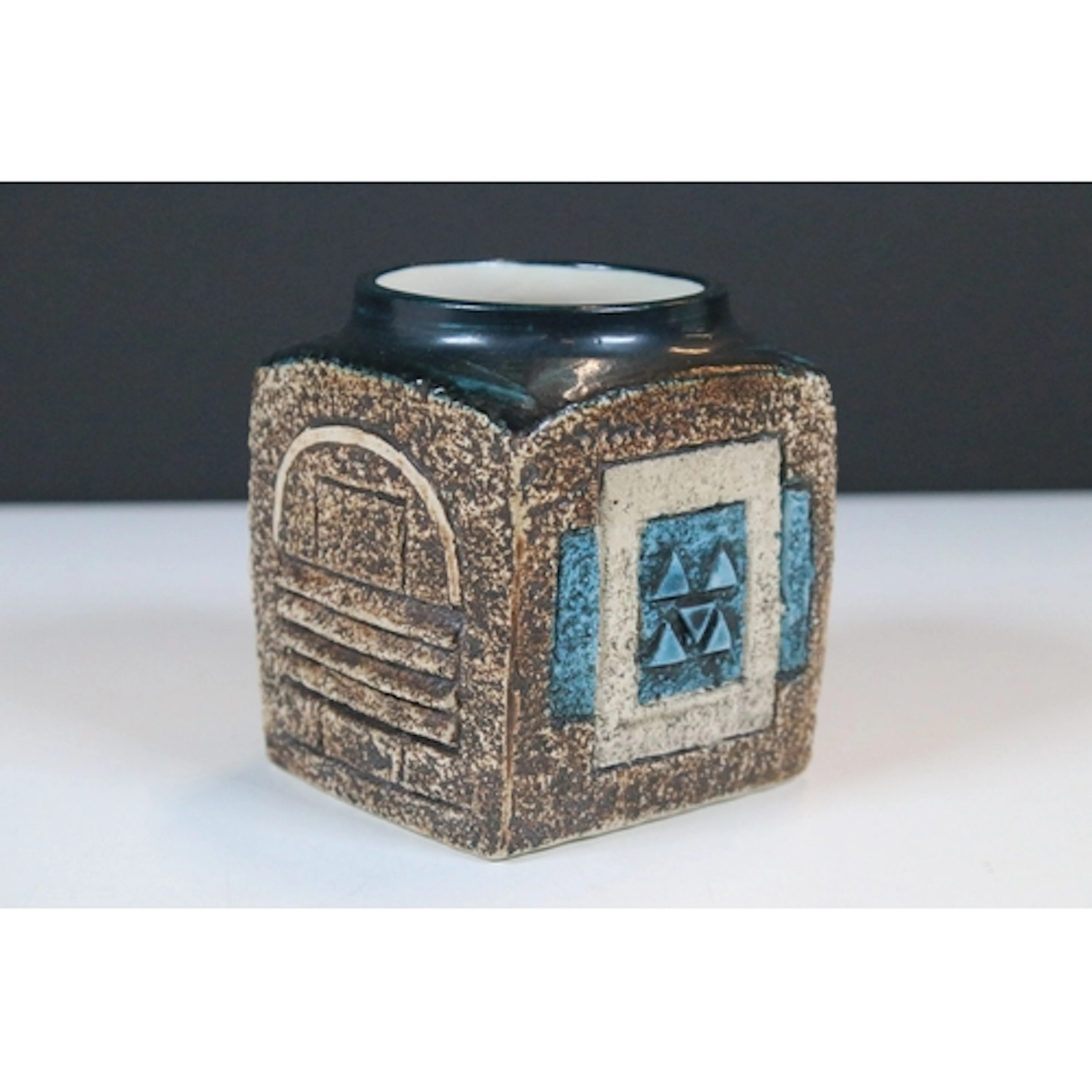 Troika pottery cube vase, decorated in blue and brown, with ...