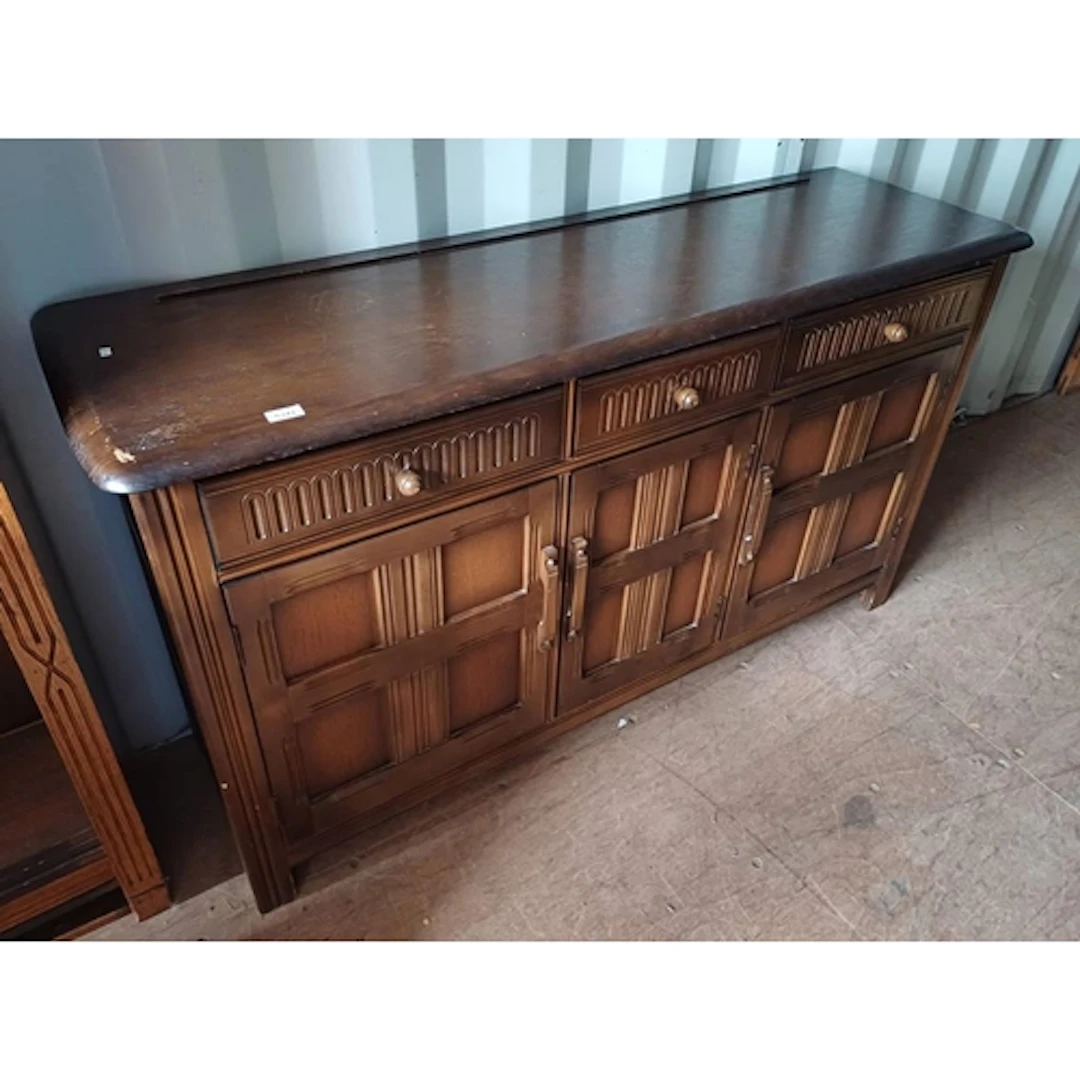 20TH CENTURY OAK SIDEBOARD WITH 3 DRAWERS OVER 3 PANEL DOORS...