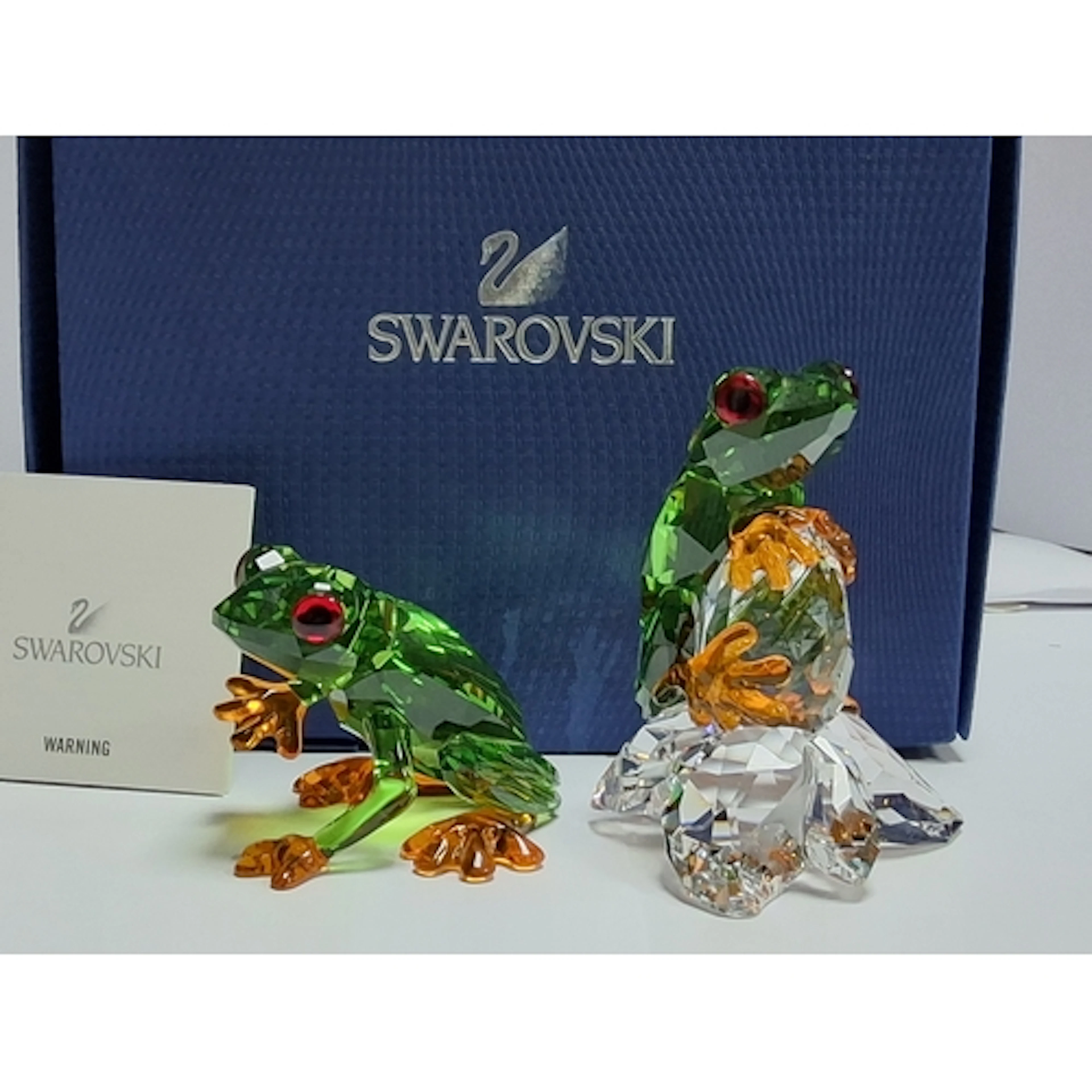 A BOXED PAIR OF SWAROVSKI CRYSTAL PARADISE FROG SCULPTURES, ...