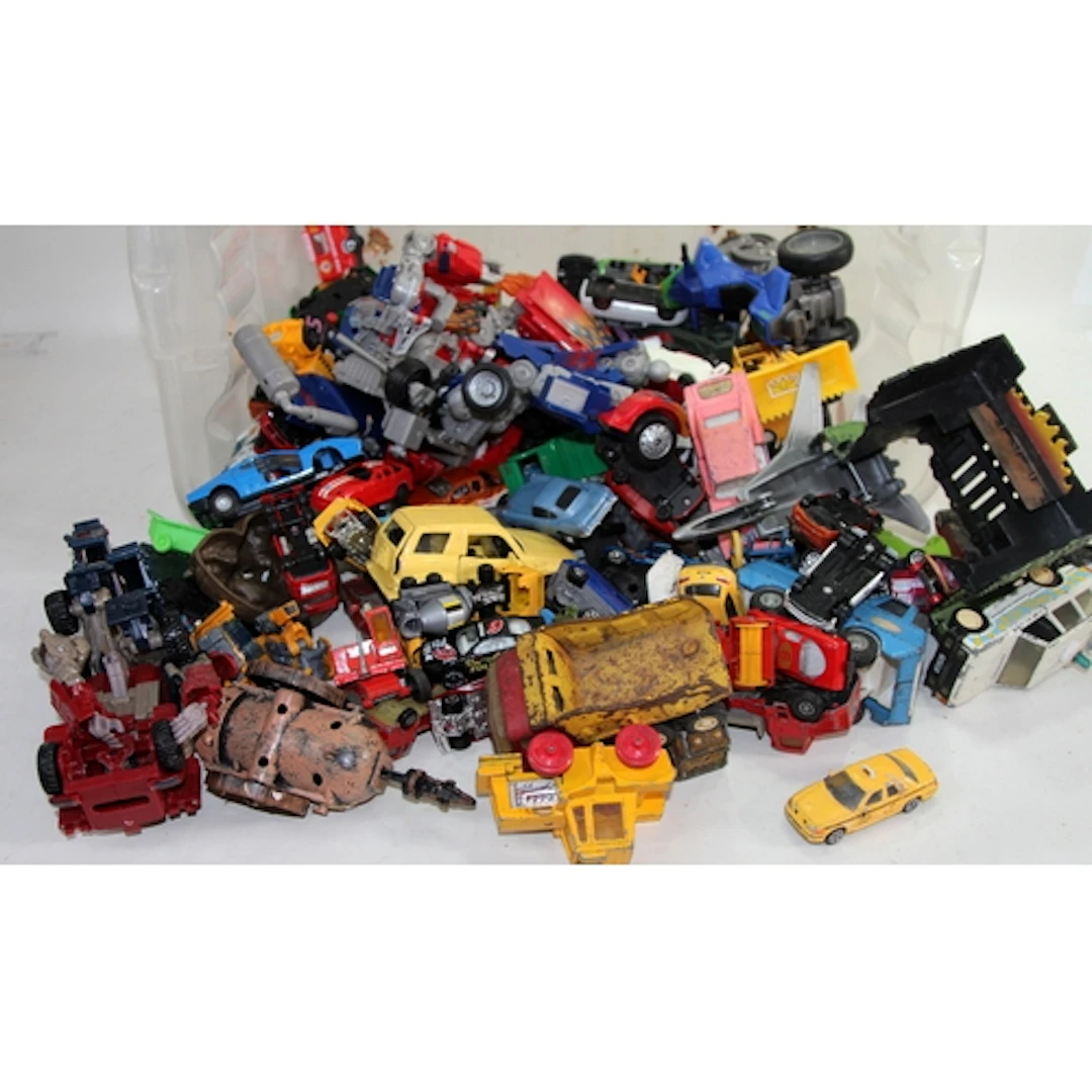 A tub of play worn die-cast model vehicles