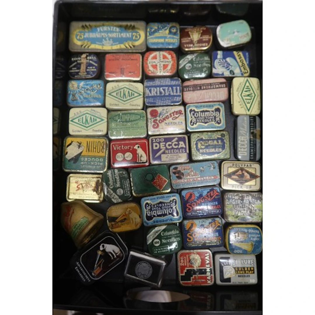 A tray of vintage gramphone needle tins