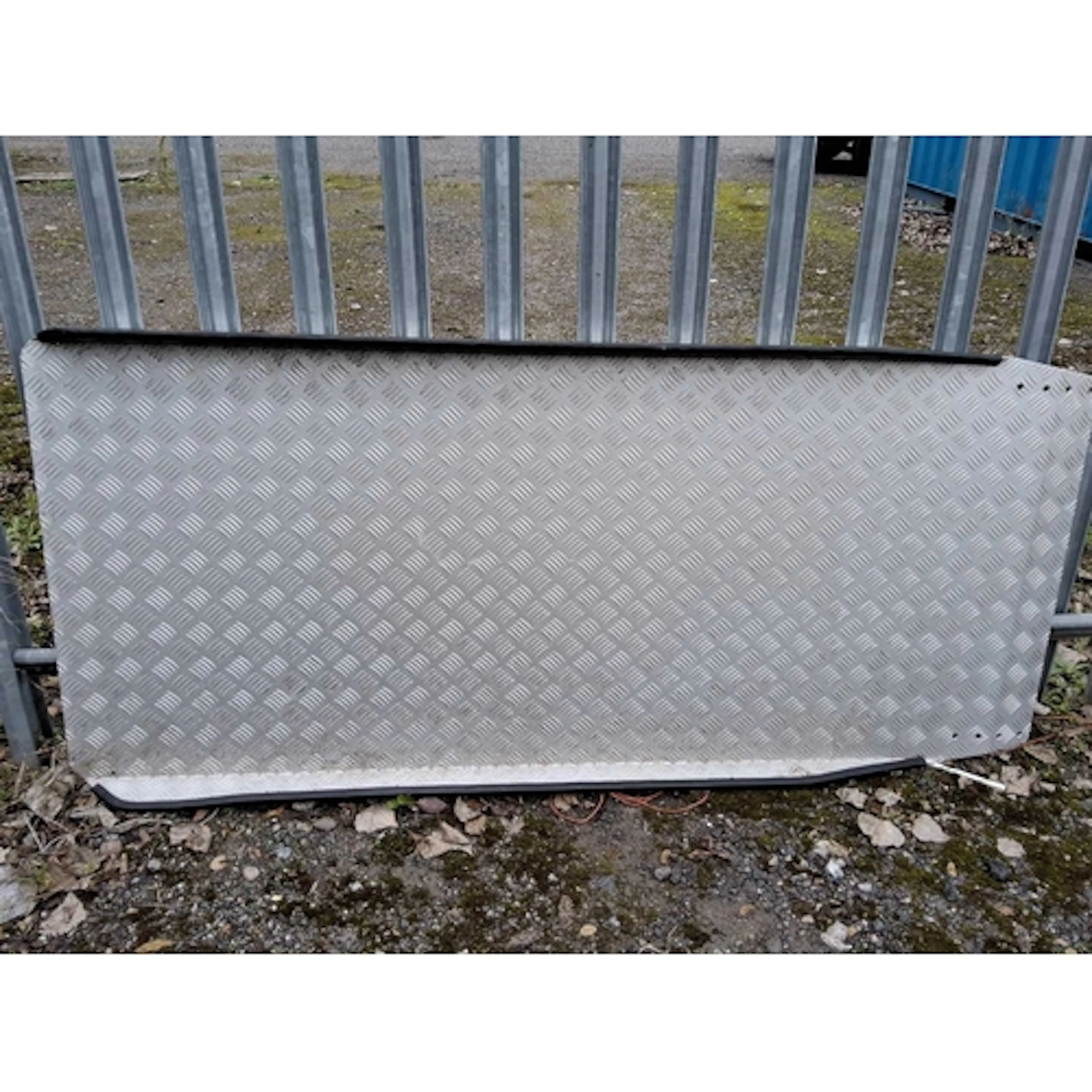AN ALUMINIUM TREAD PLATE WHEELCHAIR RAMP, with raised sides,...