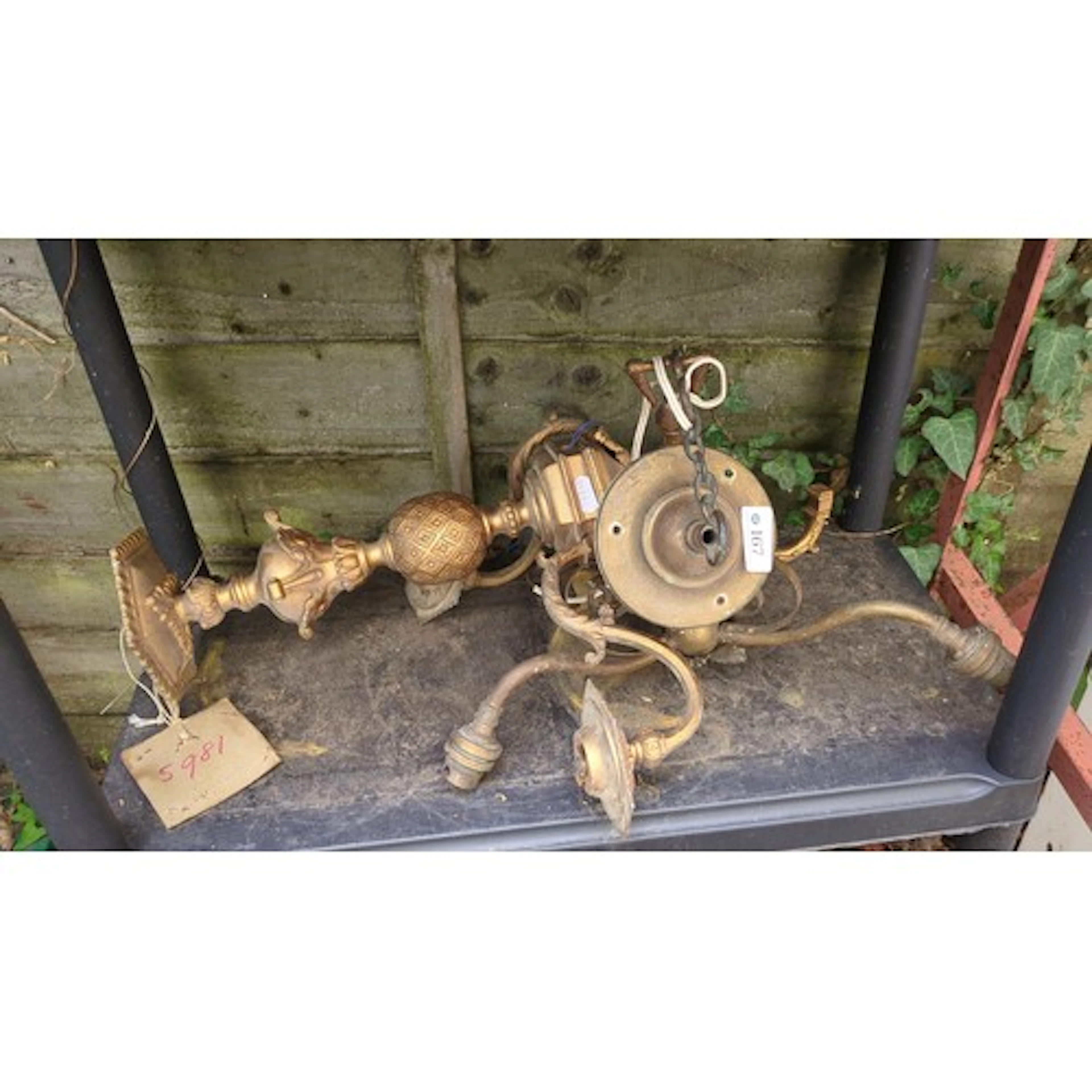 An assortment of gilt-metal lighting components, including a...