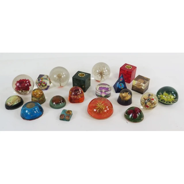A collection of assorted glass paperweights, various shapes ...