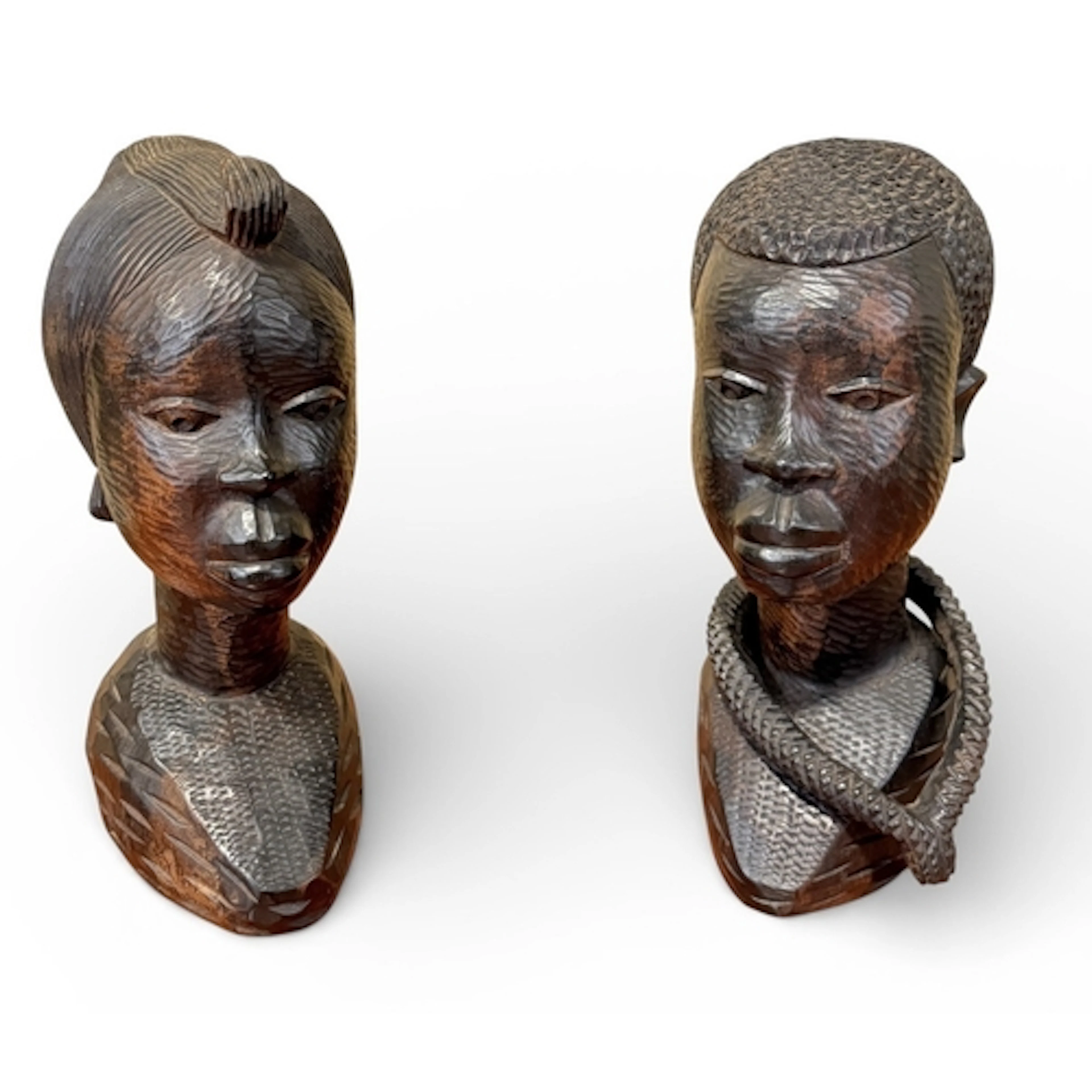 A PAIR OF AFRICAN CARVED WOODEN SCULPTURAL BUSTS, MAN AND WO...