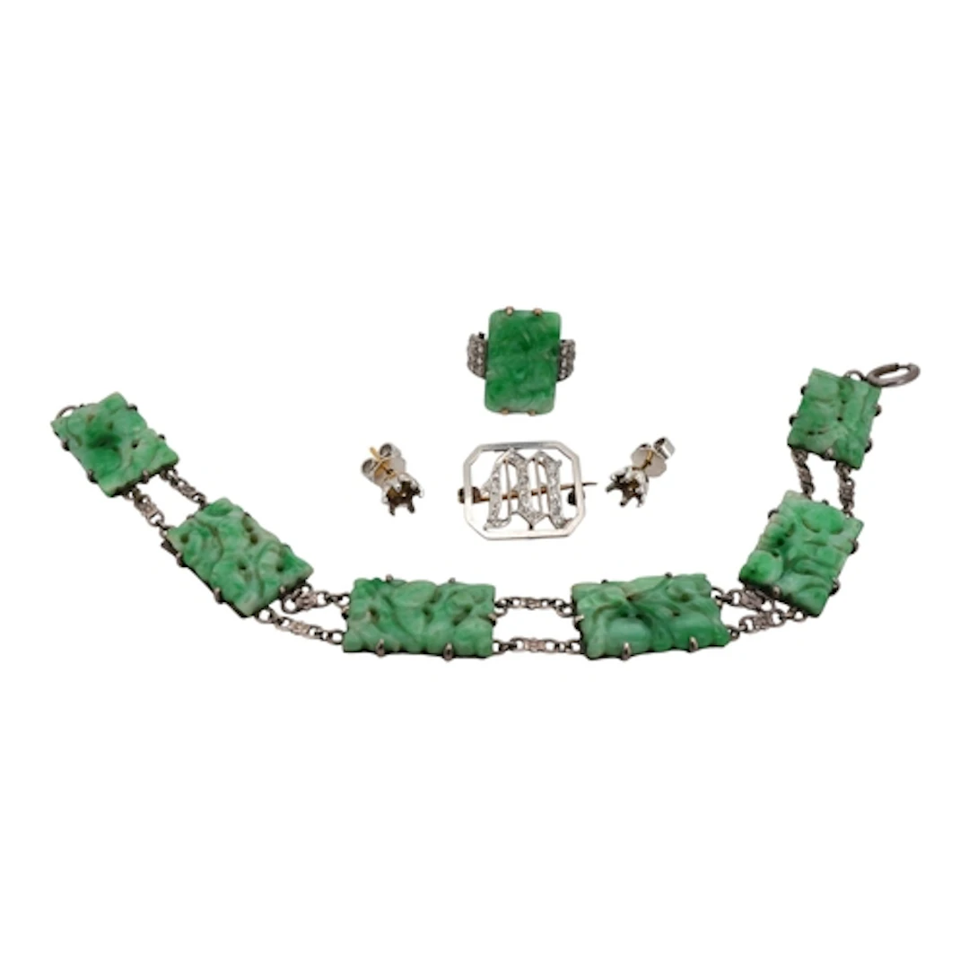 A collection of jewels, comprising: a carved jadeite ring, b...