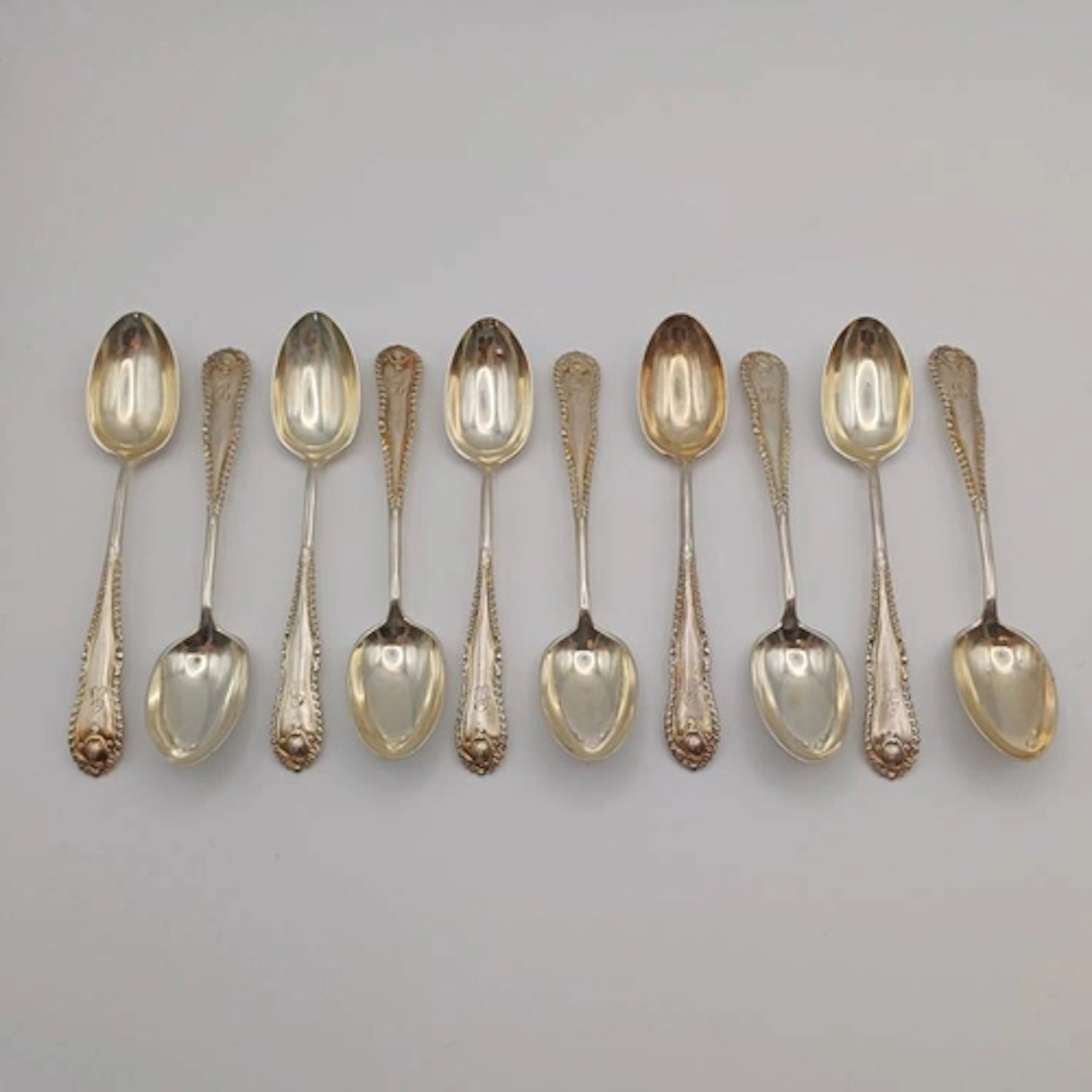 A SET OF 10 VICTORIAN SILVER COFFEE SPOONS BY JOHN ROUND & S...