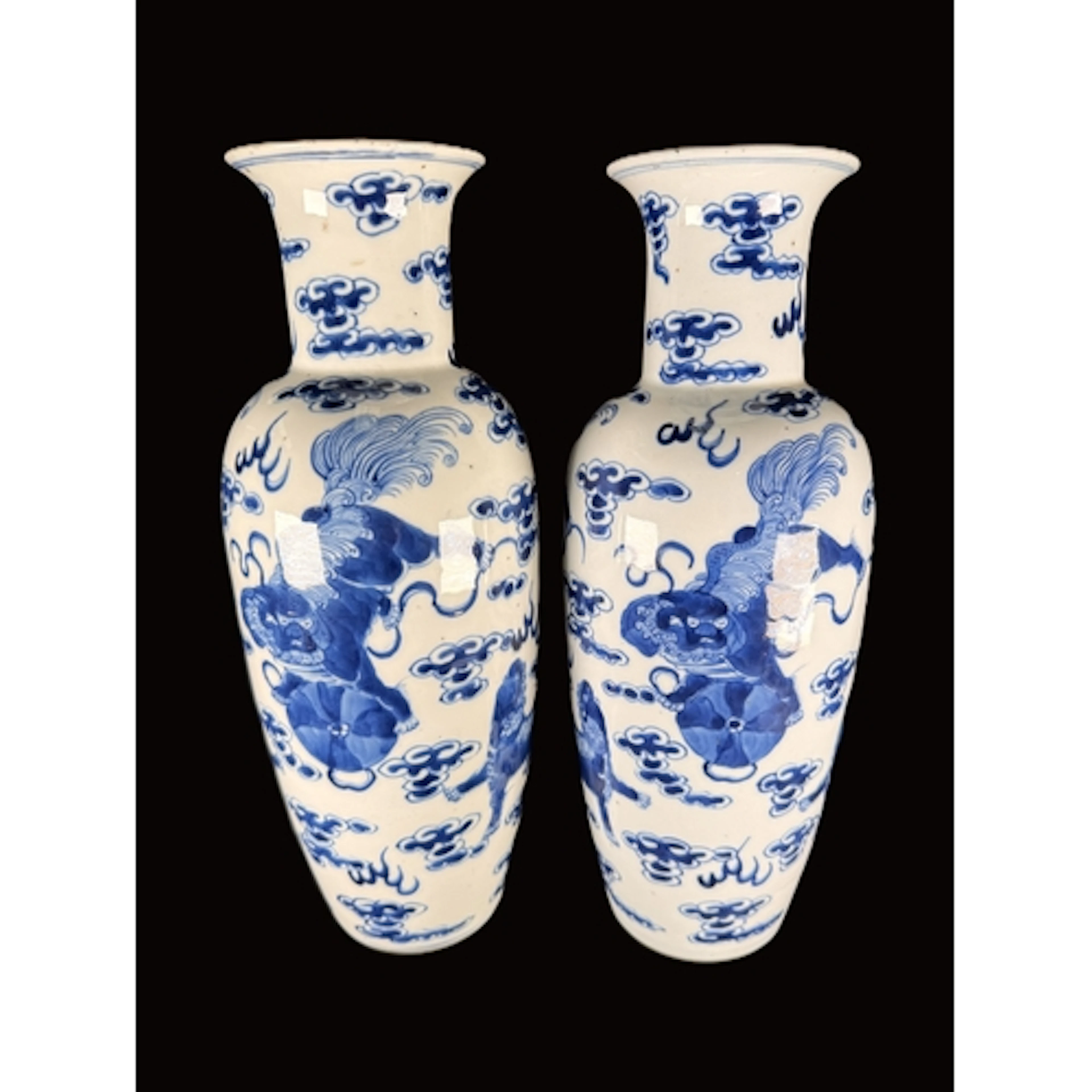 A pair of 19th century blue and white vases decorated with ...