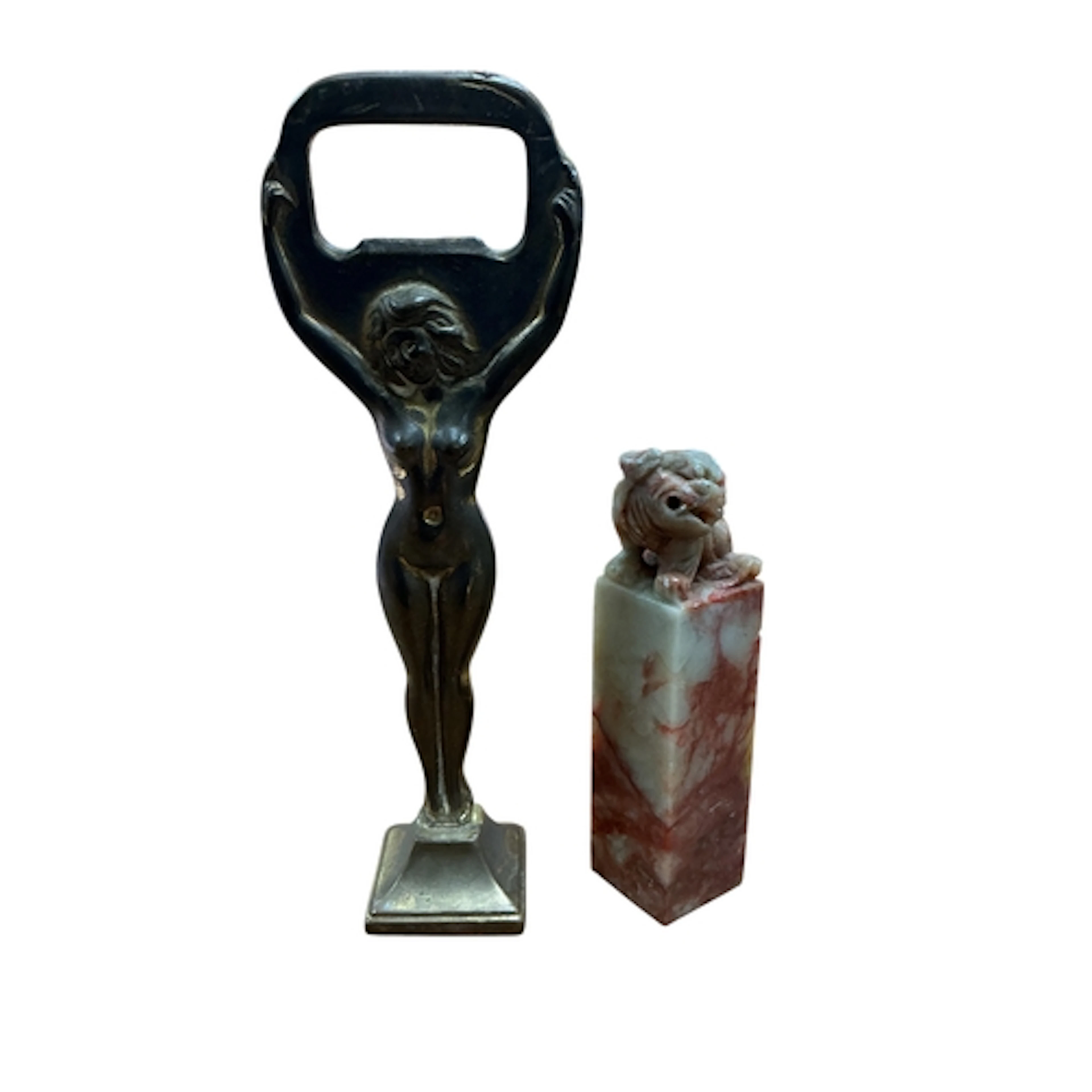 A novelty bottle opener in the form of a female nude, togeth...