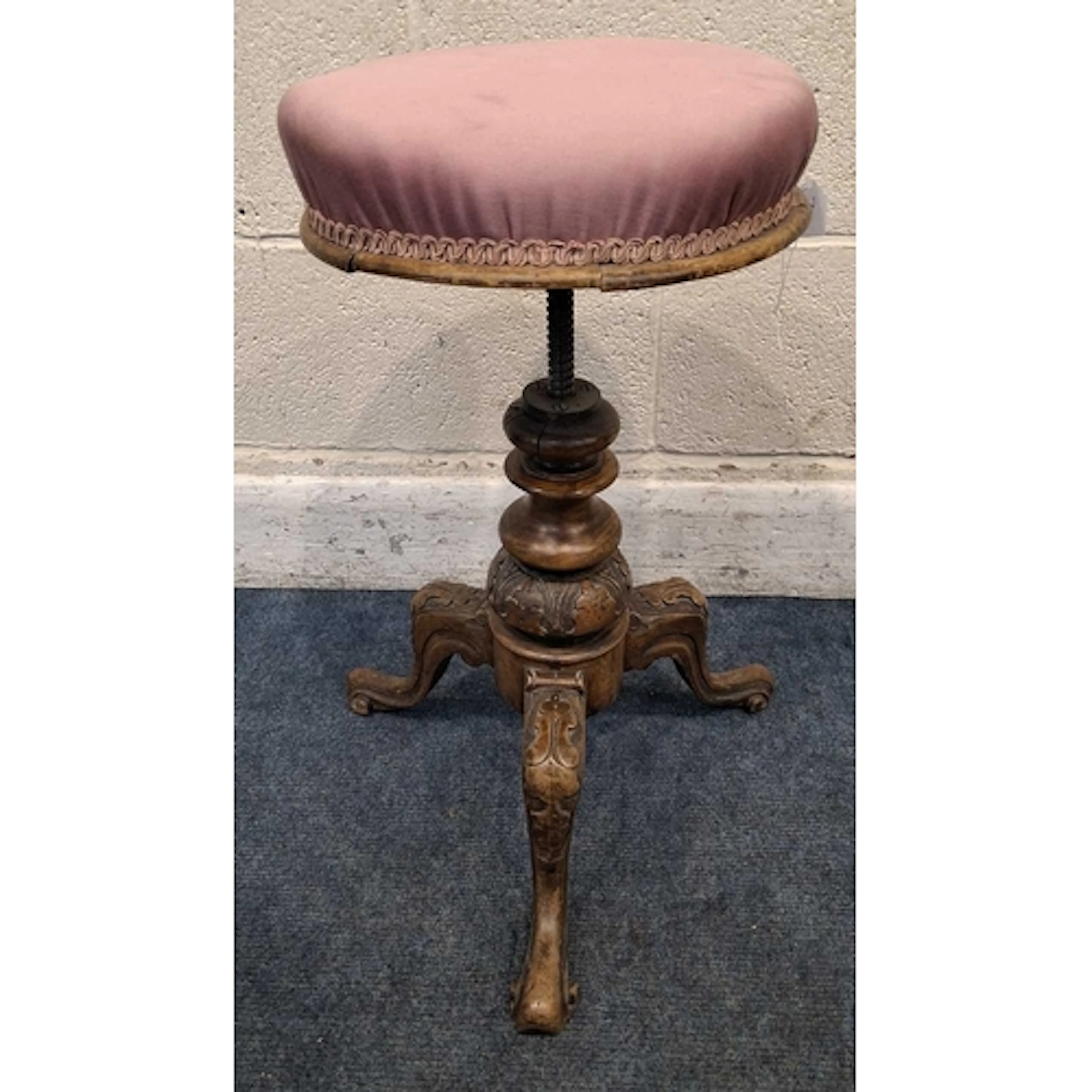 A VICTORIAN PIANO STOOL, the height-adjustable swivel seat w...