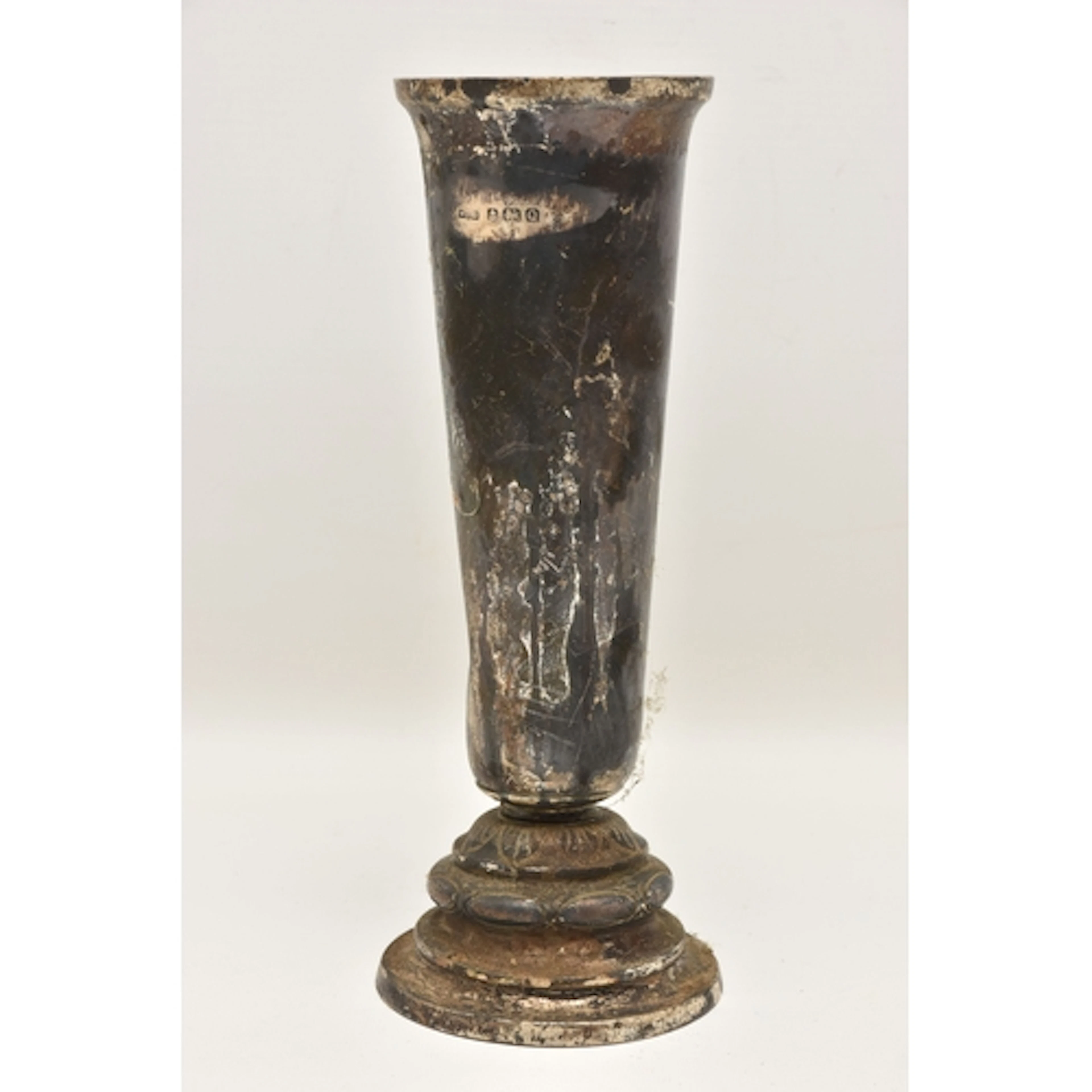 A GEORGE VI SILVER VASE, heavily tarnished, tapering form va...
