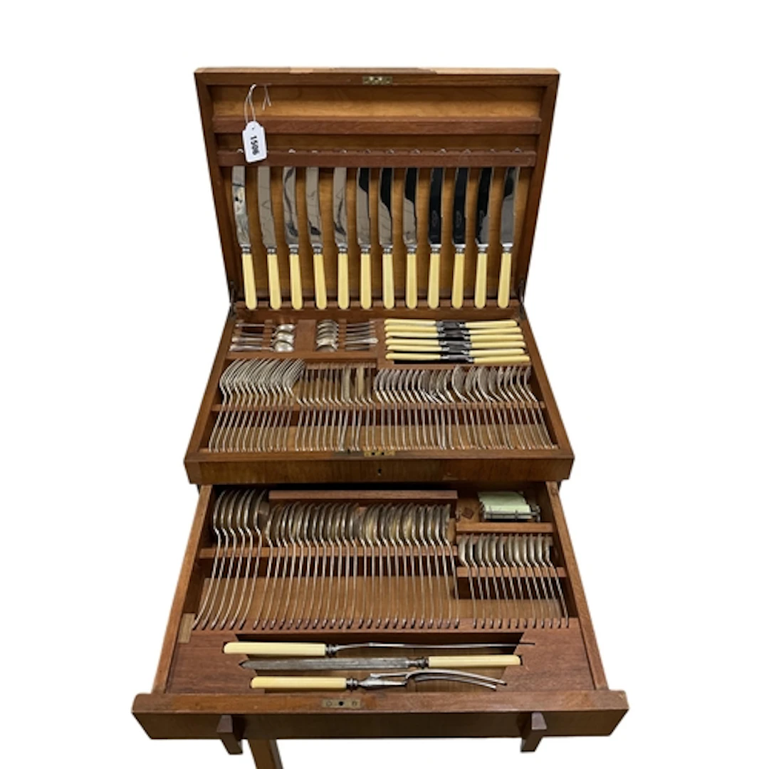 An Art Deco walnut cased, silver plated canteen of cutlery, ...
