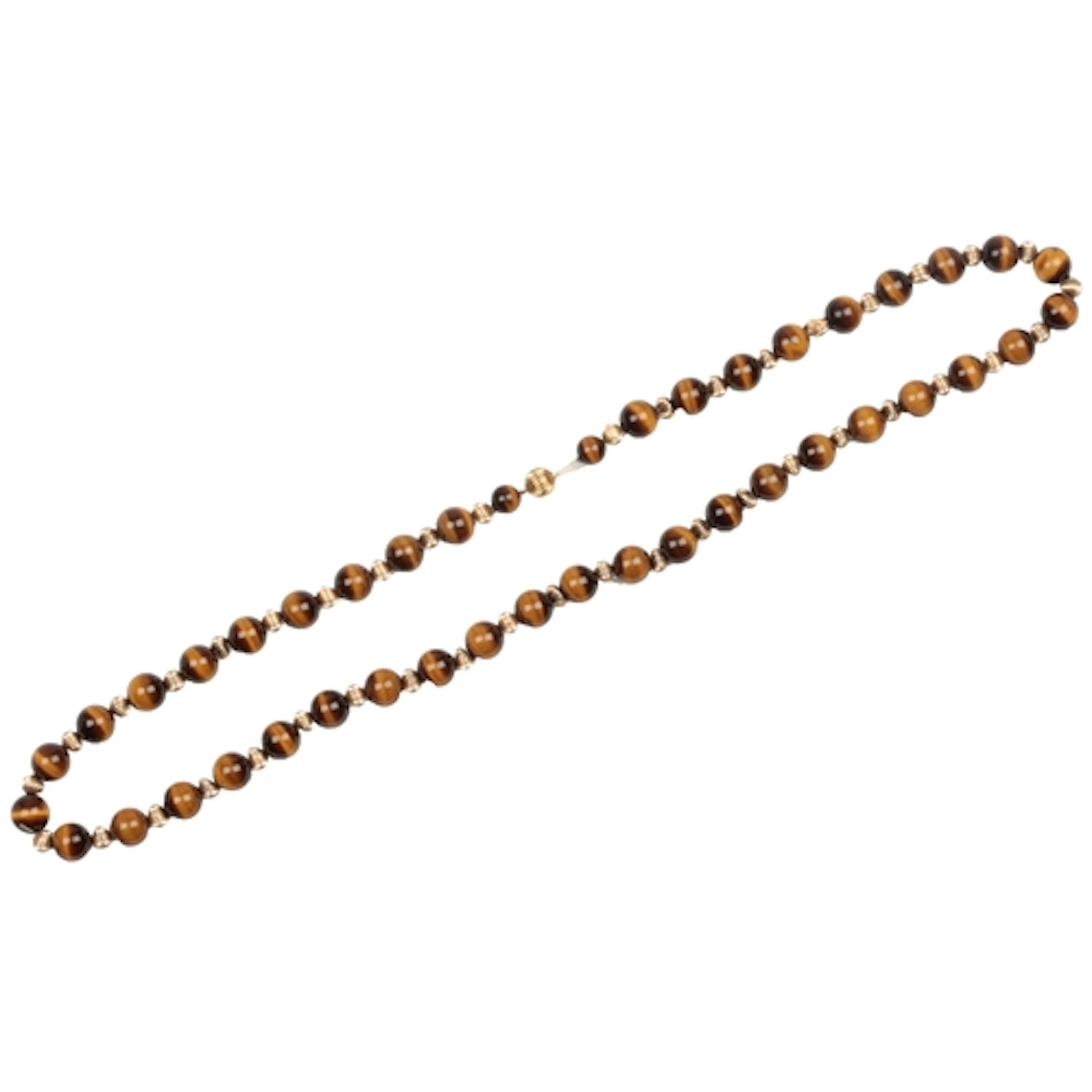 A gold and tiger's eye necklace, composed of spherical tiger...