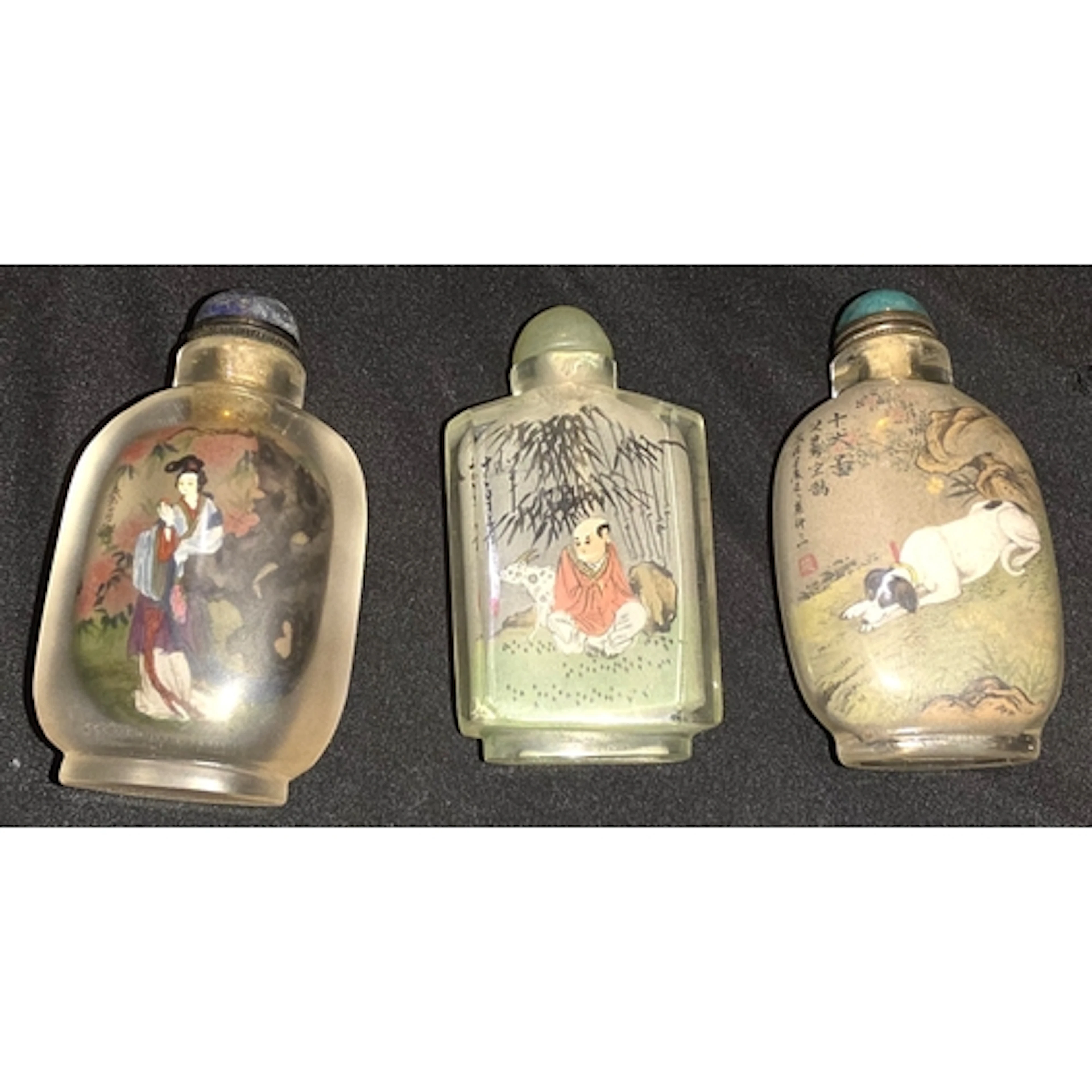 Three Chinese glass reverse painted snuff bottles with stopp...
